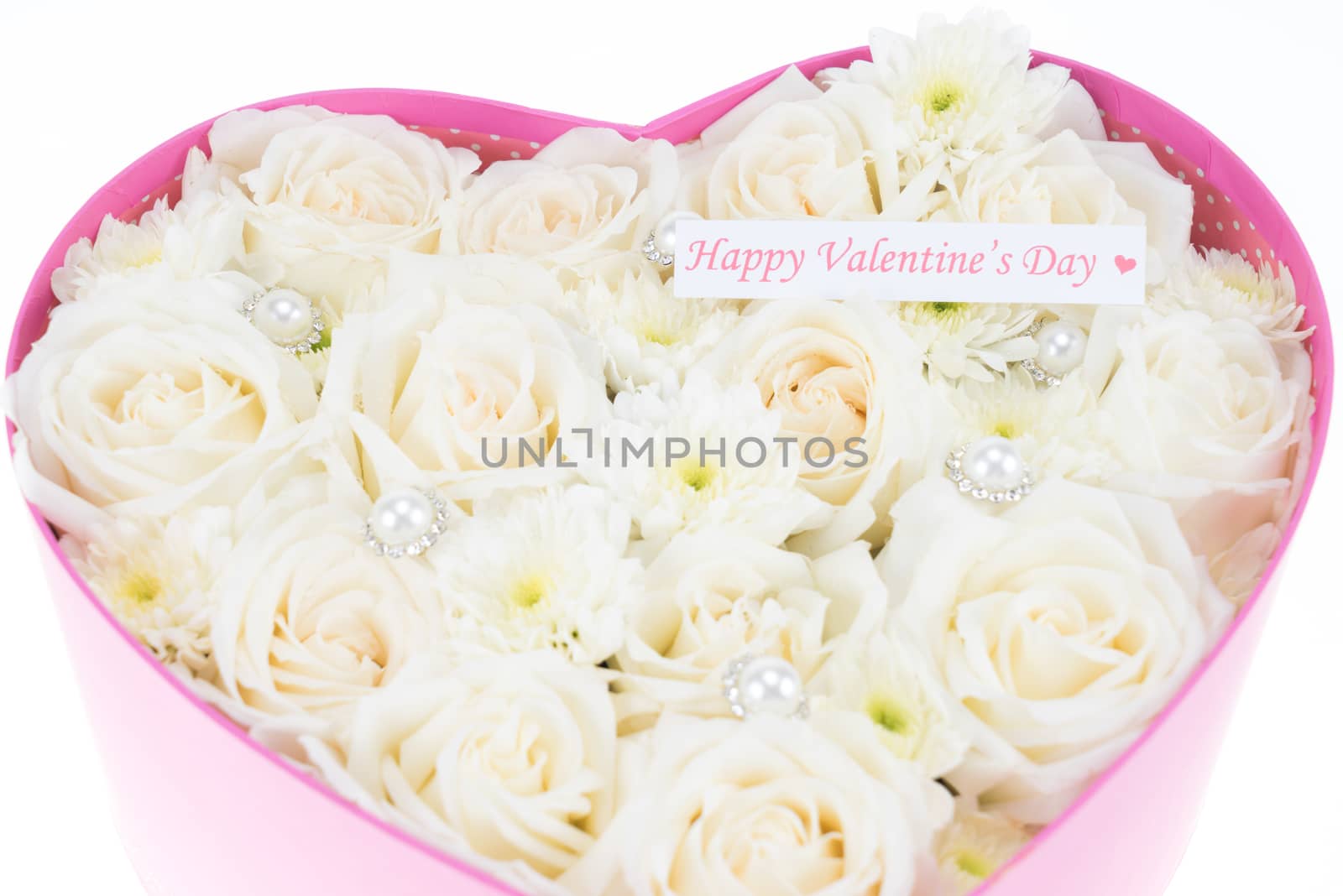 White roses and pearl and diamond held in the heart shape box with "happy valentine's day" text label. gift for valentine 's day, isolated on white background