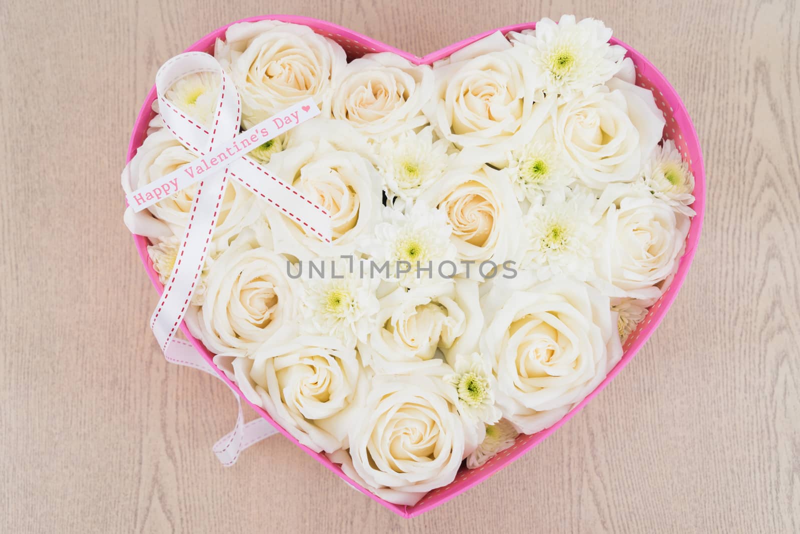 White roses and pearl and diamond held in the heart shape box by iamway