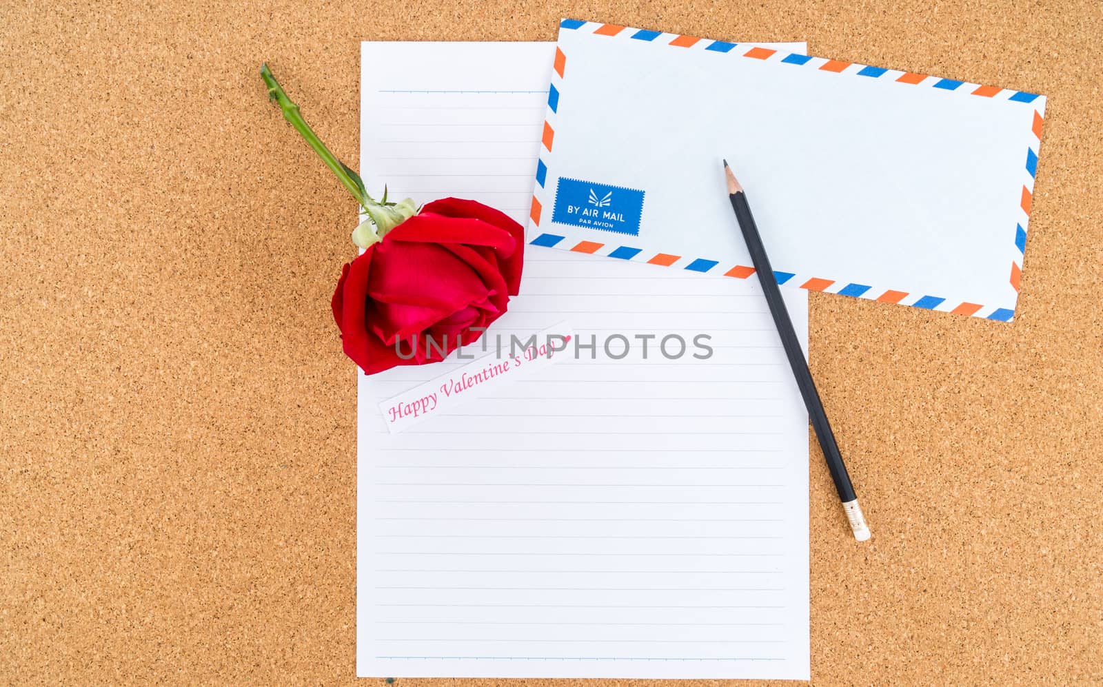 Cardboard, corkboard with note paper with pencil and rose beside by iamway