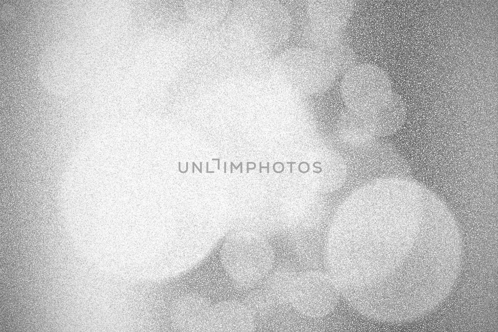 Pointillized black and white bokeh abstract background.