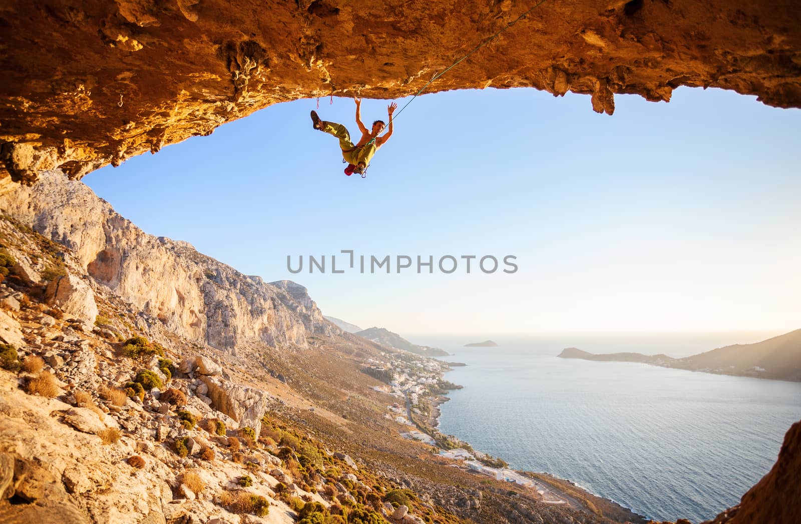 Male climber has just fell of a cliff by photobac