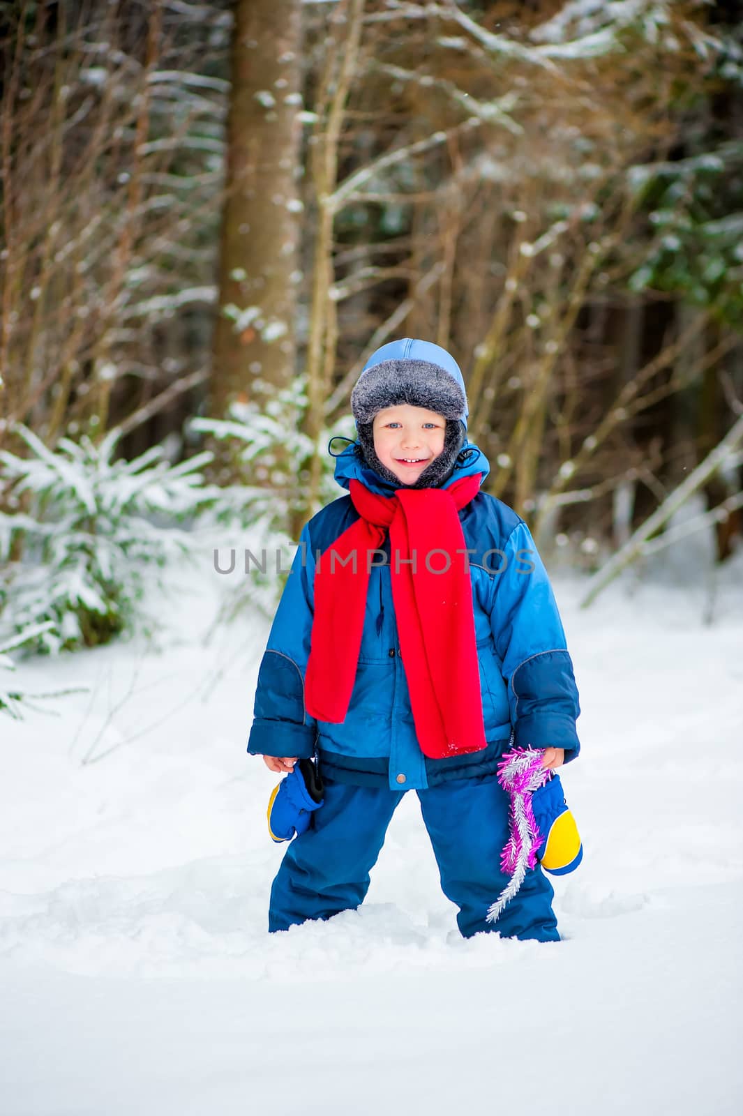 cheerful boy 4 years old laughing in winter by kosmsos111