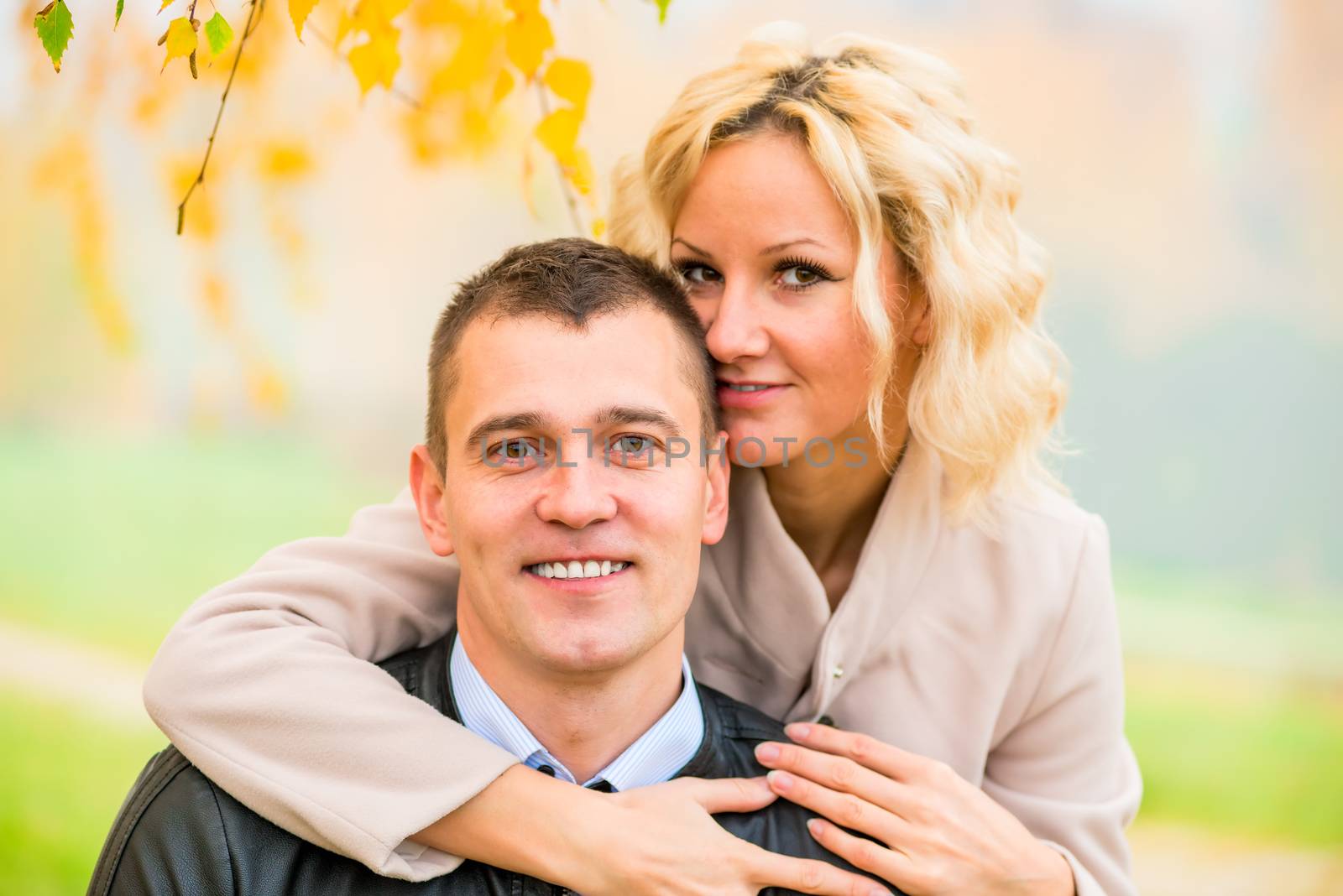 portrait of happy young love couple on nature