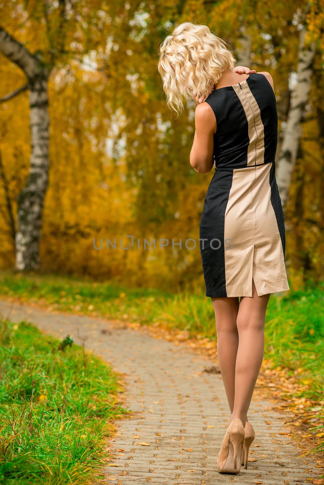 slim blonde walks alone in the park by kosmsos111