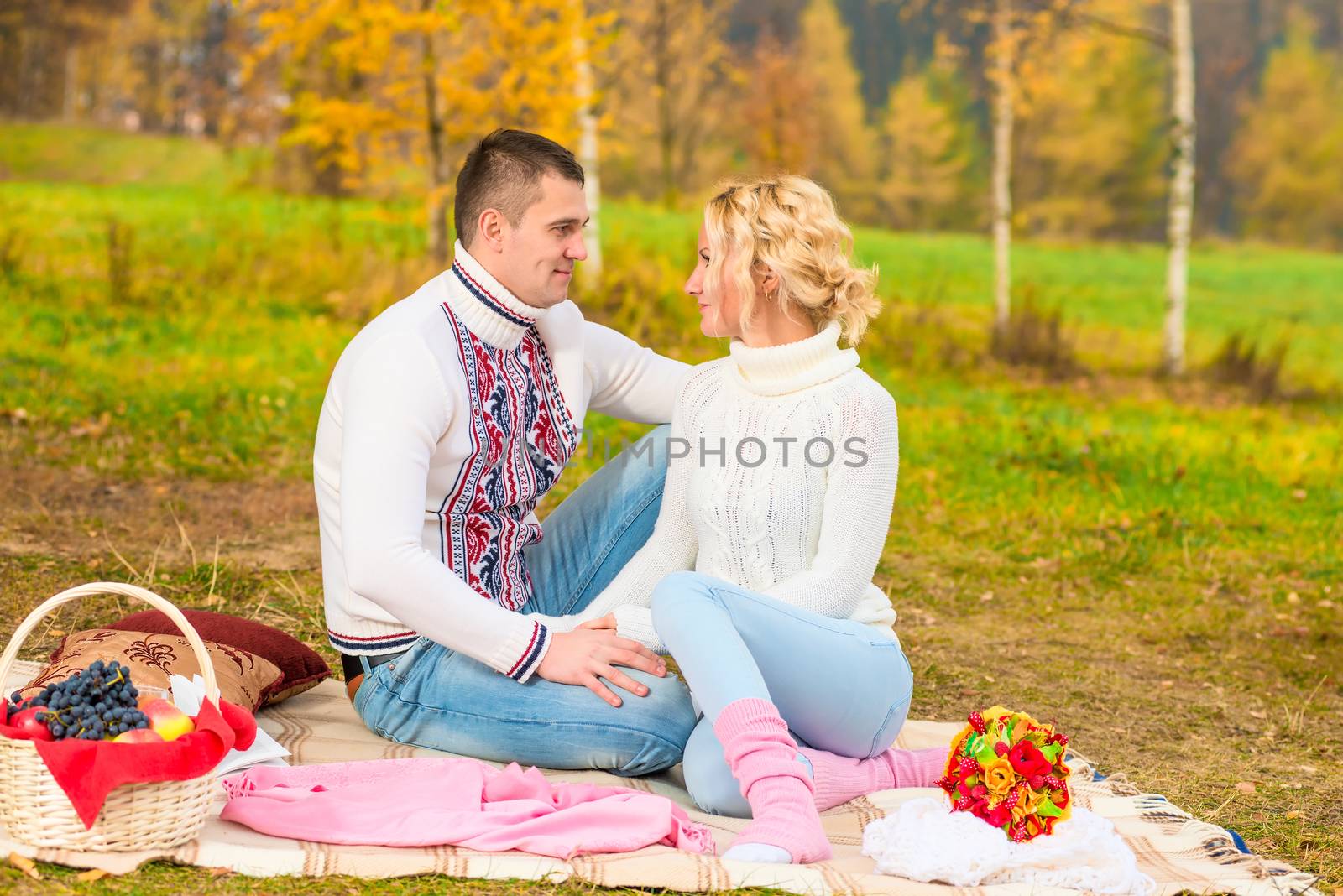 married couple looking into each other's eyes in the park