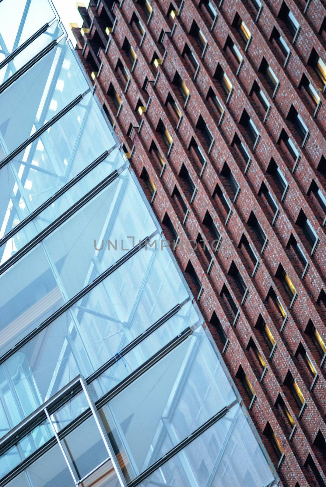 Transparent glass wall and brick building