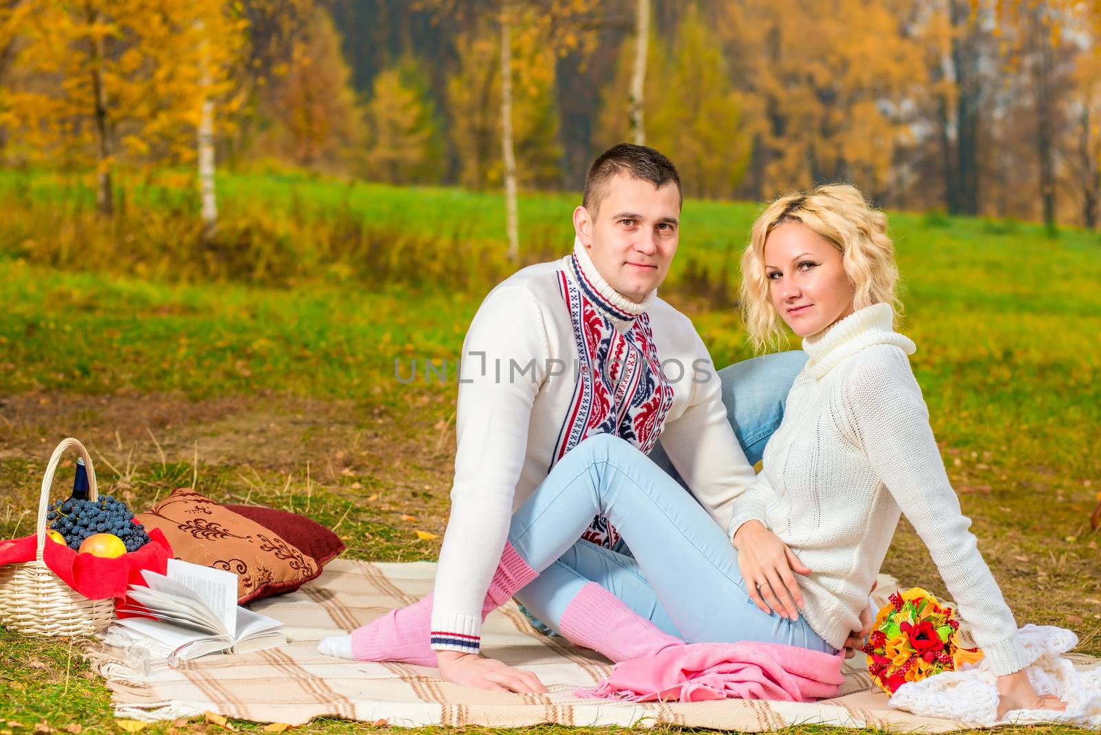 family picnic young couple in autumn park on the nature by kosmsos111