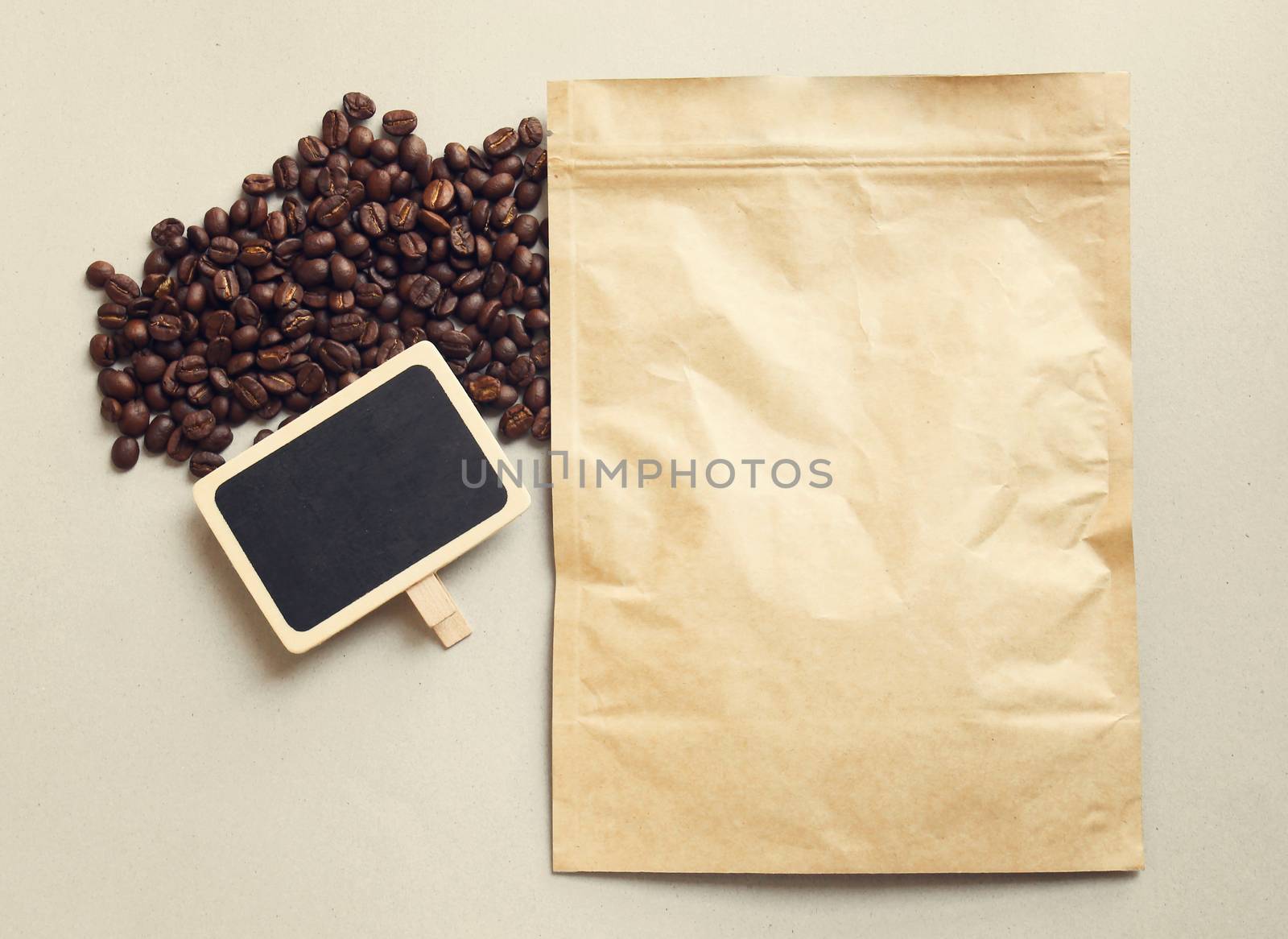 Bag of coffee and blank blackboard with coffee beans, retro filter effect