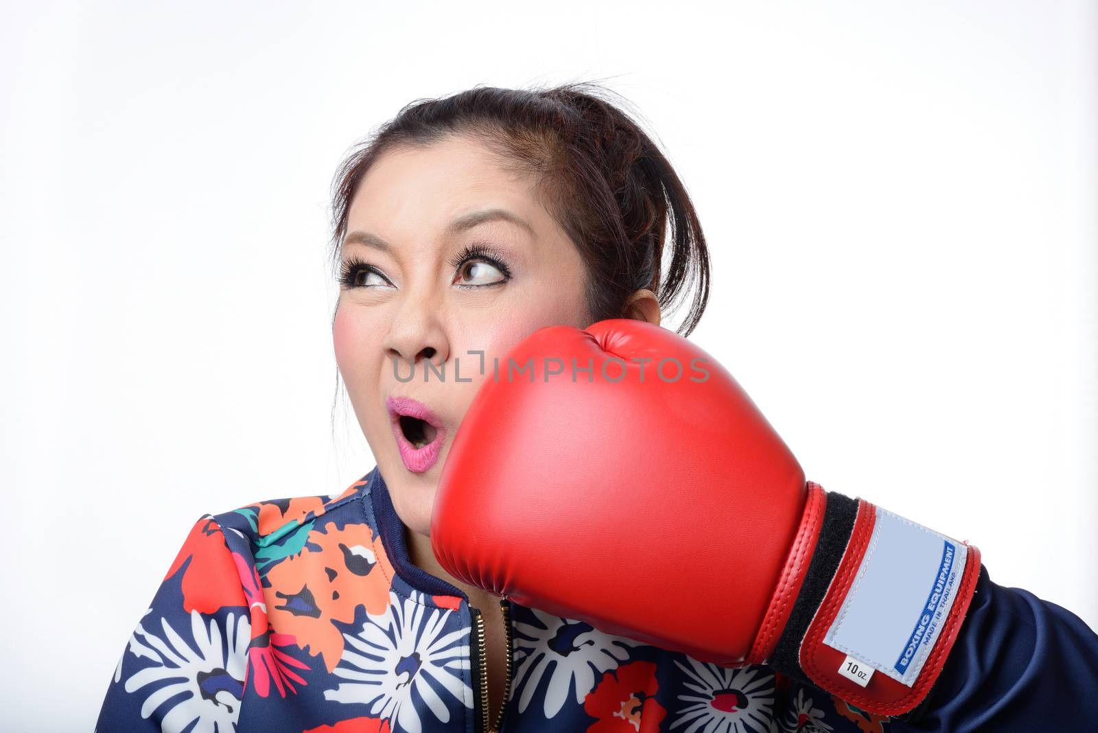 asian woman with red boxing glove punch her face on white background