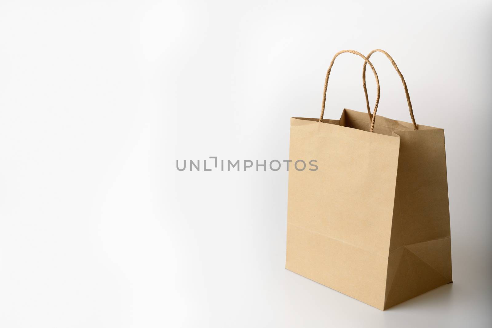 brown paper bag on white background by numskyman