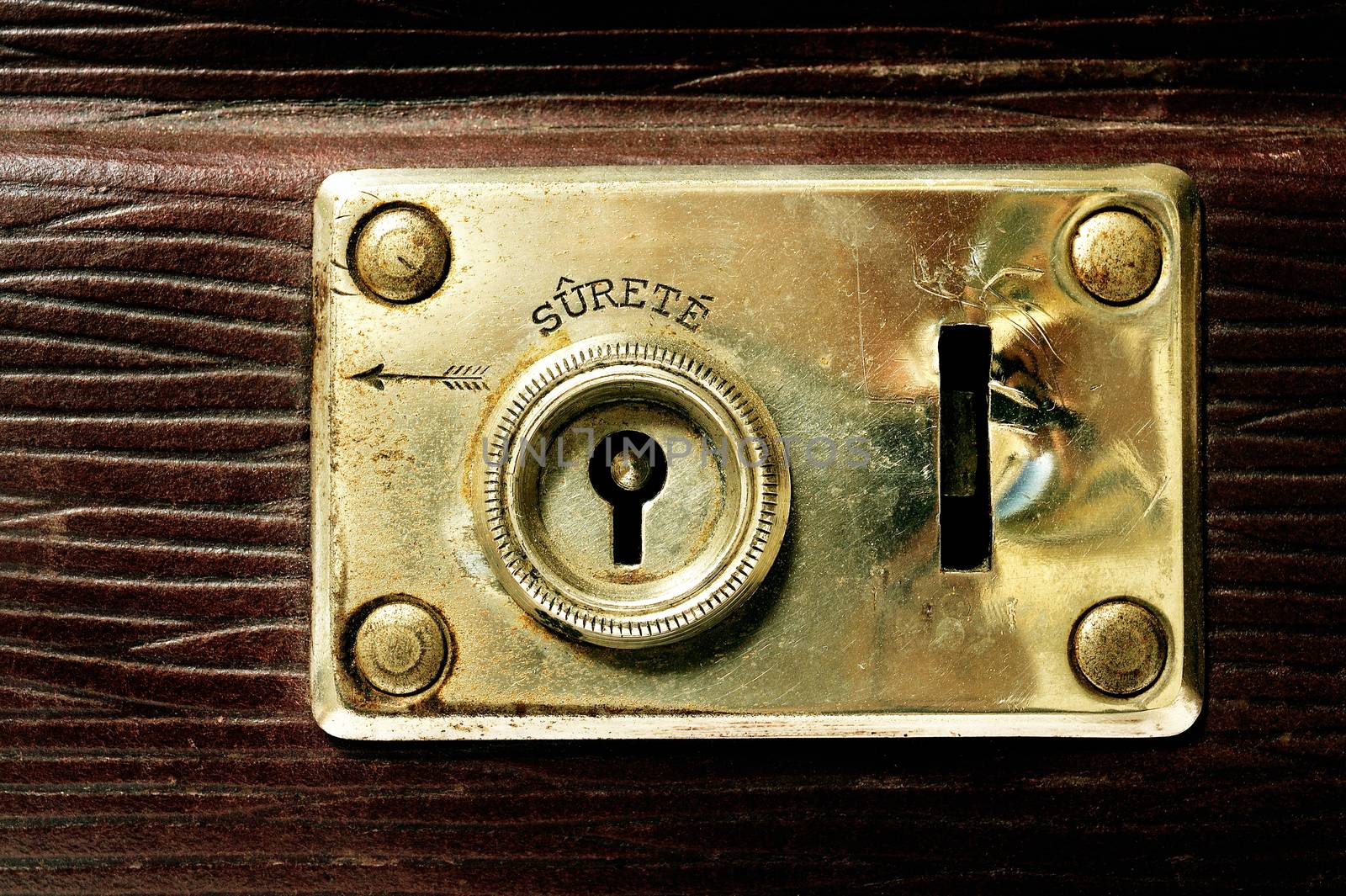 Focus on the lock of an old suitcase