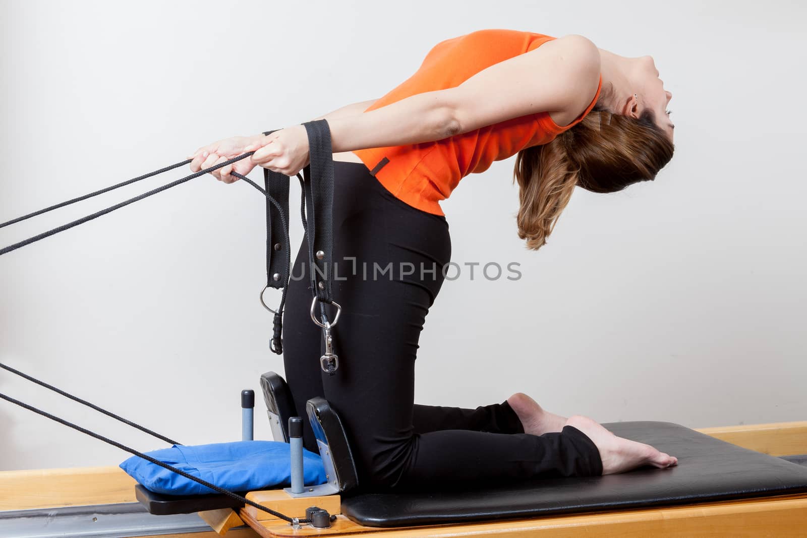 Woman stretching with the machine