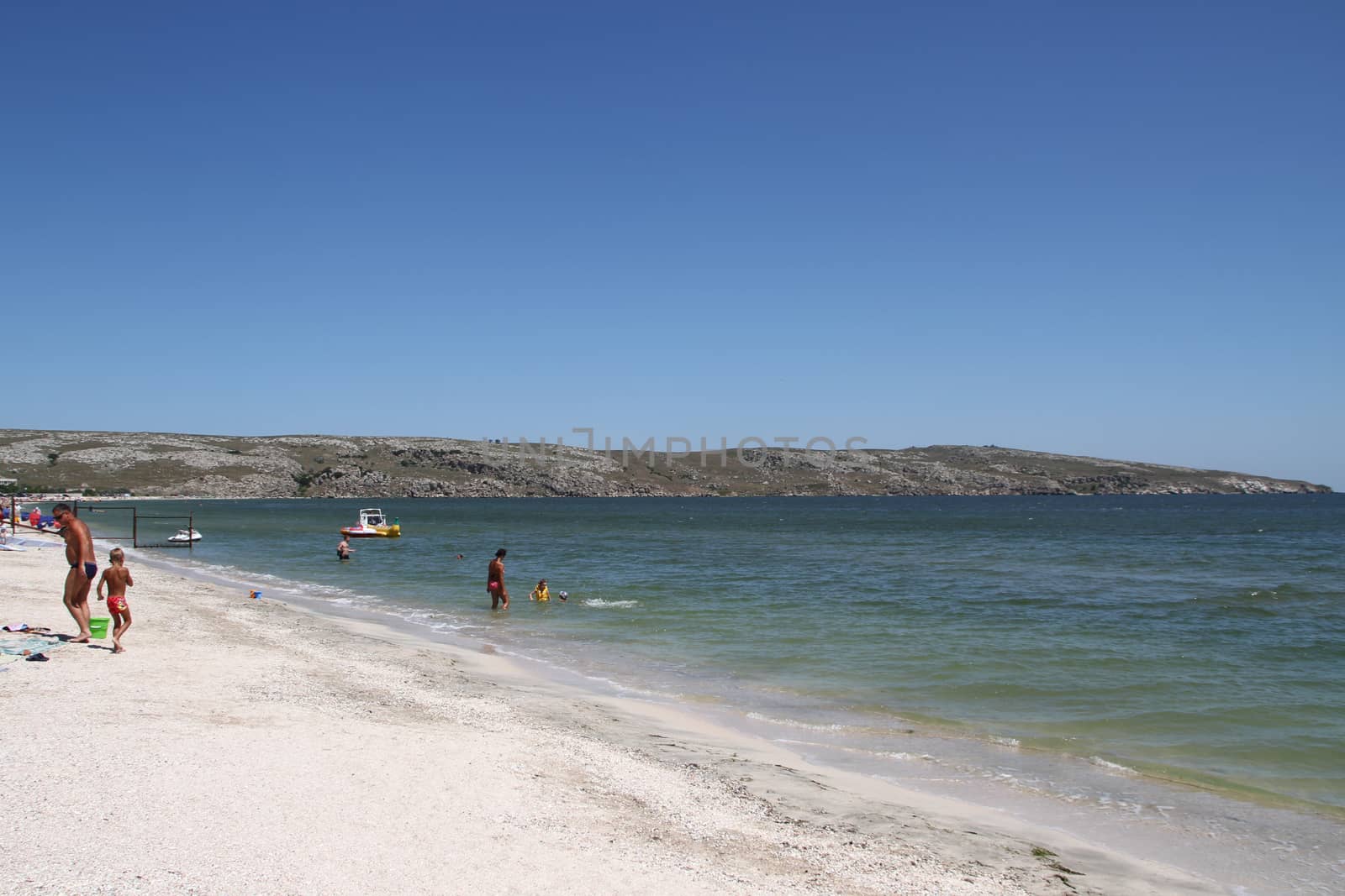 Shcholkine, Crimea, Ukraine - June 16, 2012. View of the Cape Kazantip beach side of the Tatar Bay summer in the holiday season