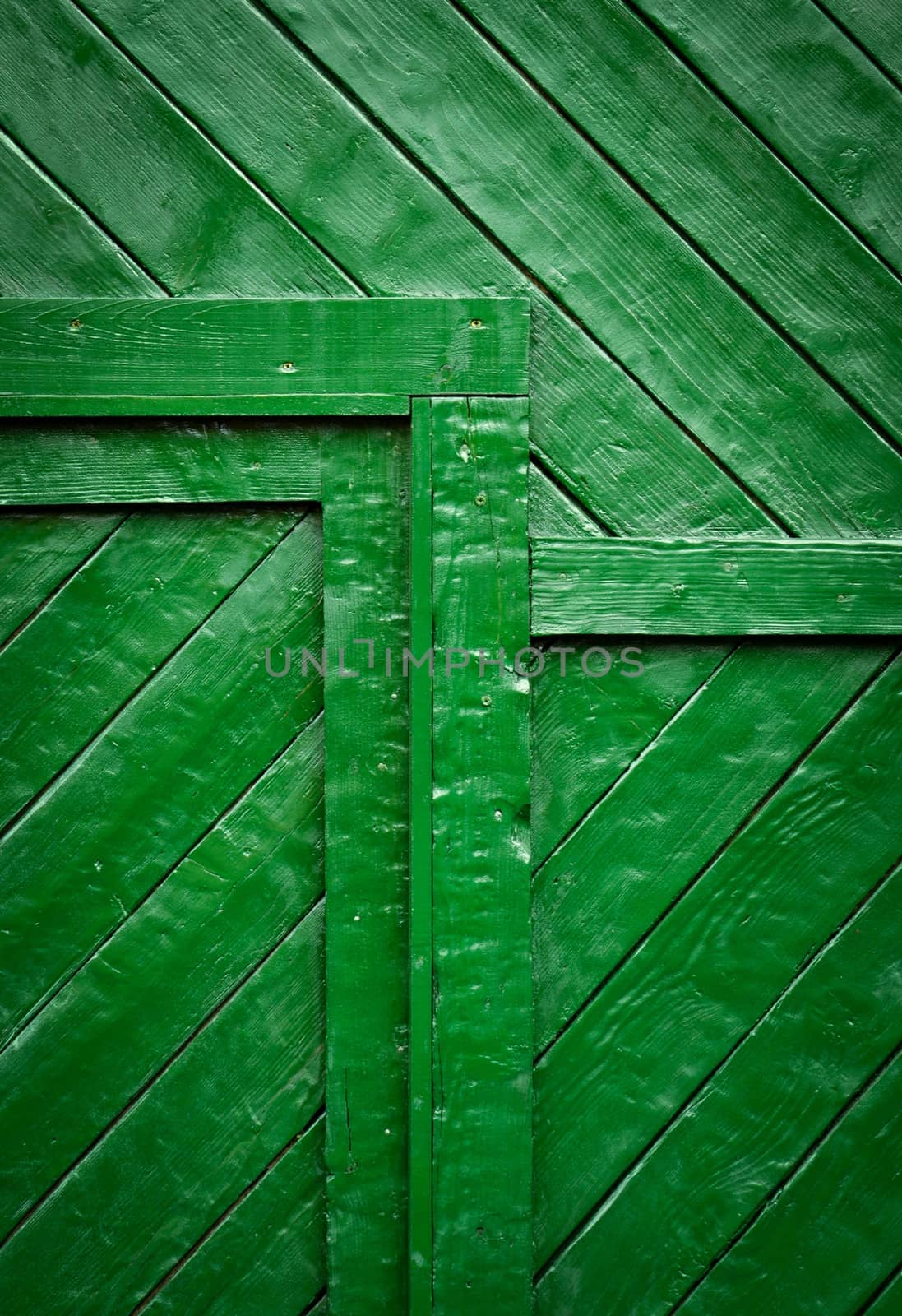 detail of a green wooden gates by Ahojdoma