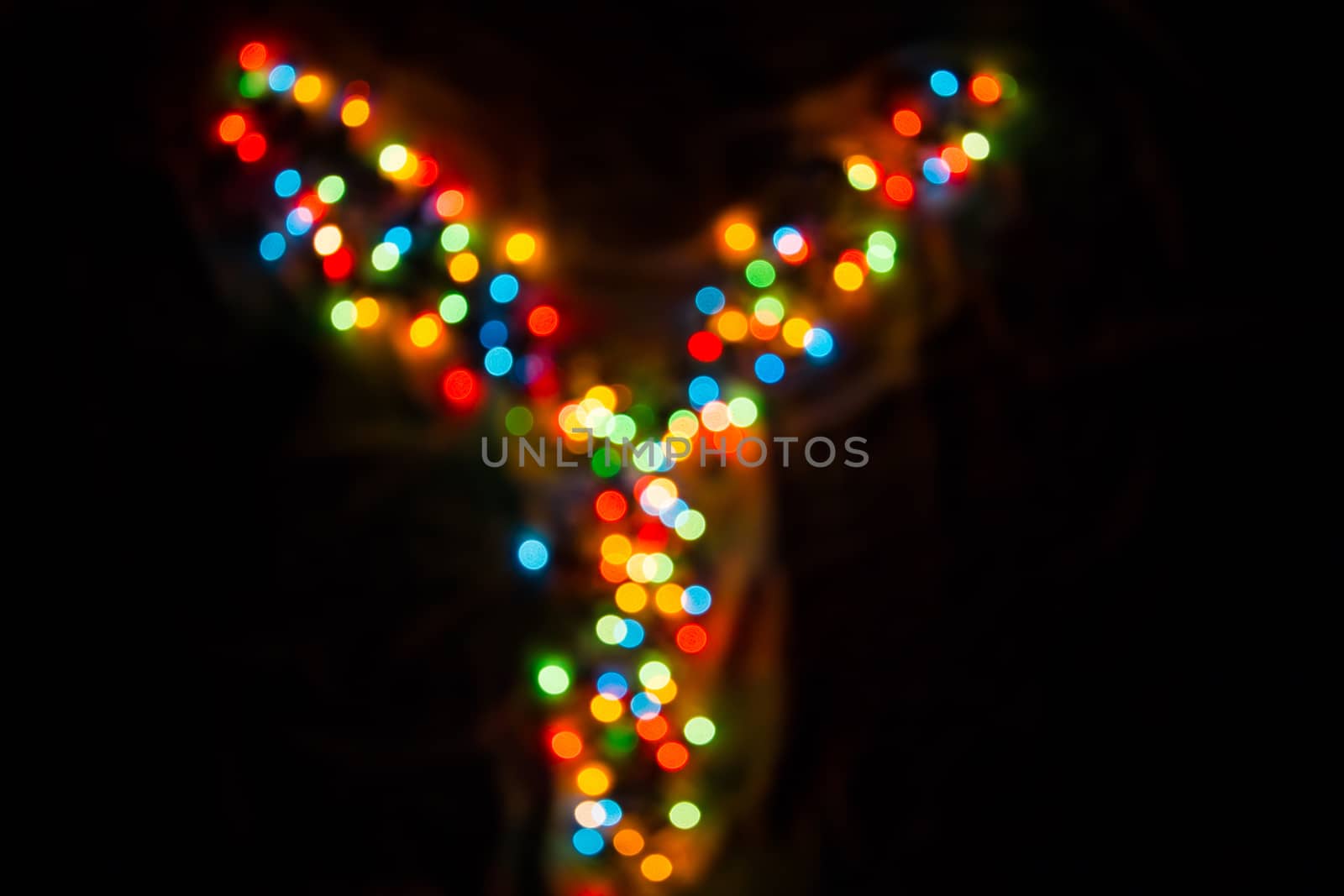 defocused colorful letter Y made of blurred circular bokeh on black background