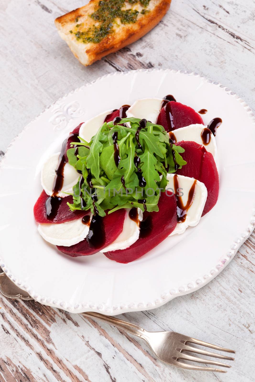 Delicious salad with beet, goat cheese and arugula. by eskymaks