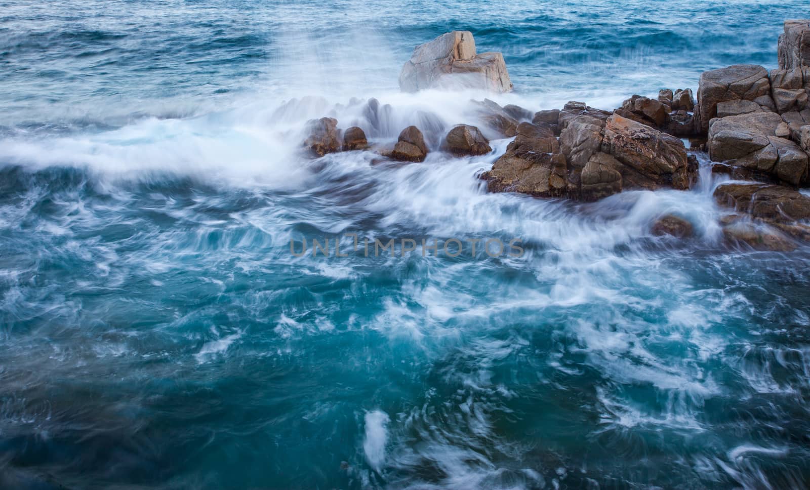 waves of the sea and coastal rocks, surf. shot at slow shutter speeds