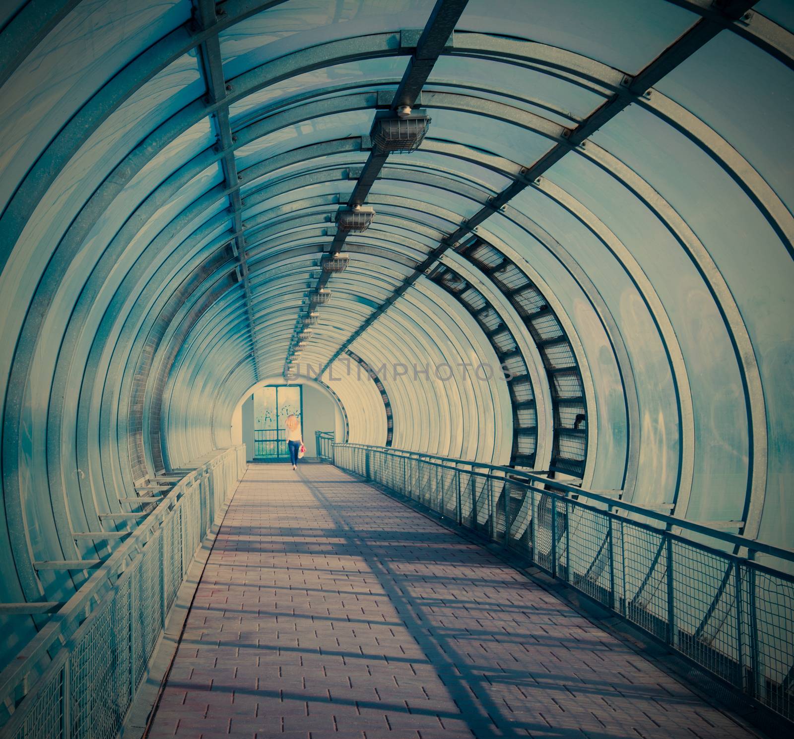 blue air pedestrian tunnel over a wide highway, instagram image style