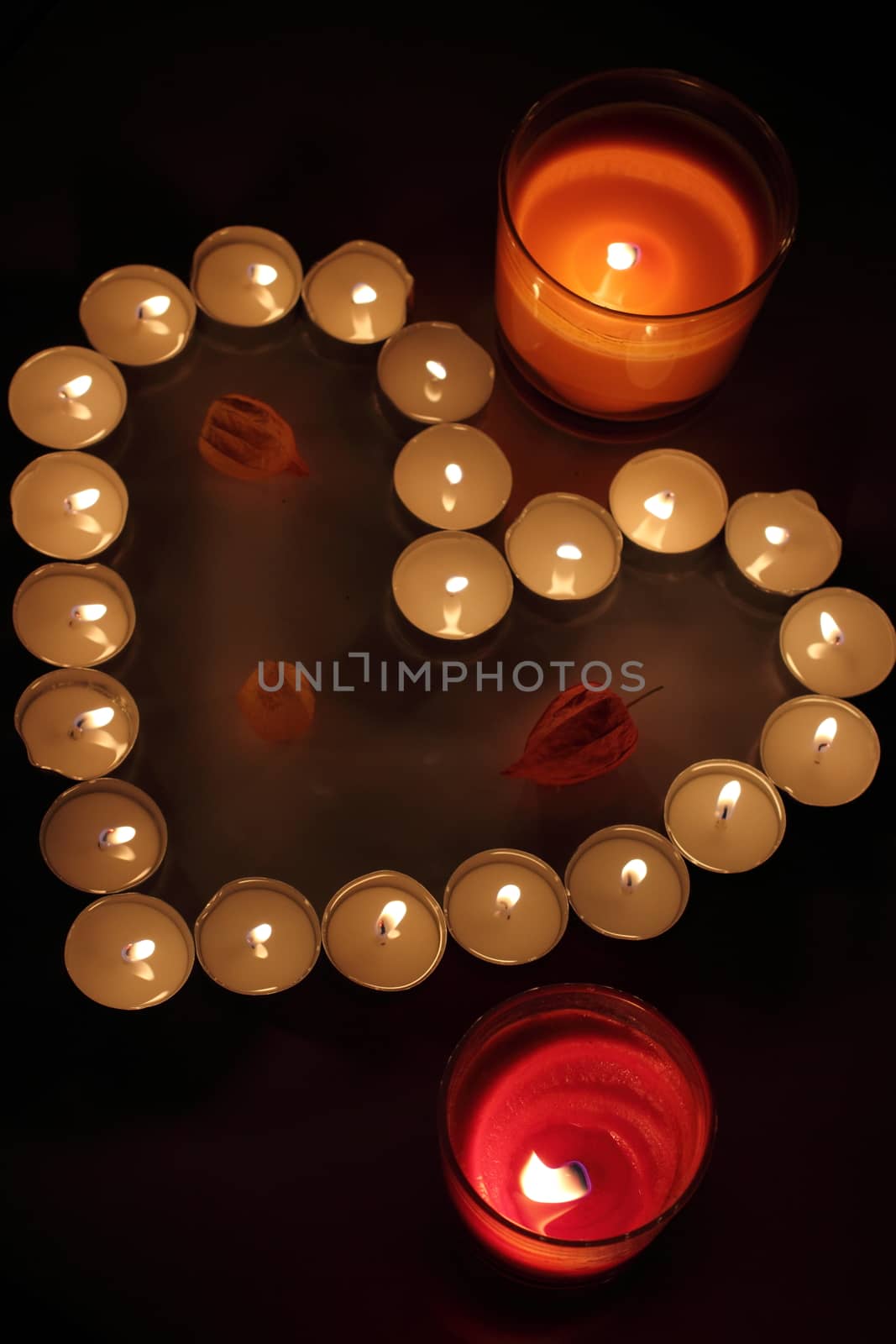 Heart of candles, a sign of love. romantic evening