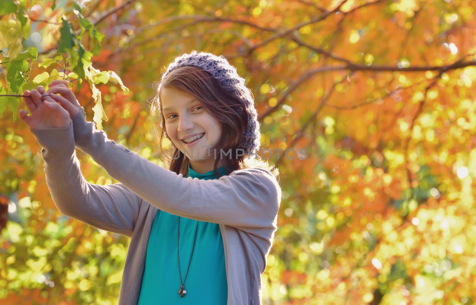 portrait of beautiful teen  in autumn park