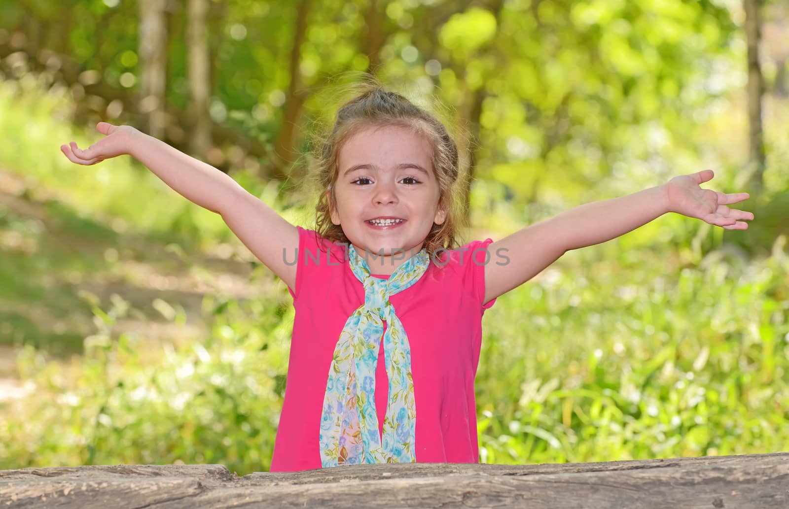 little girl enjoying and raising her hands  by mady70