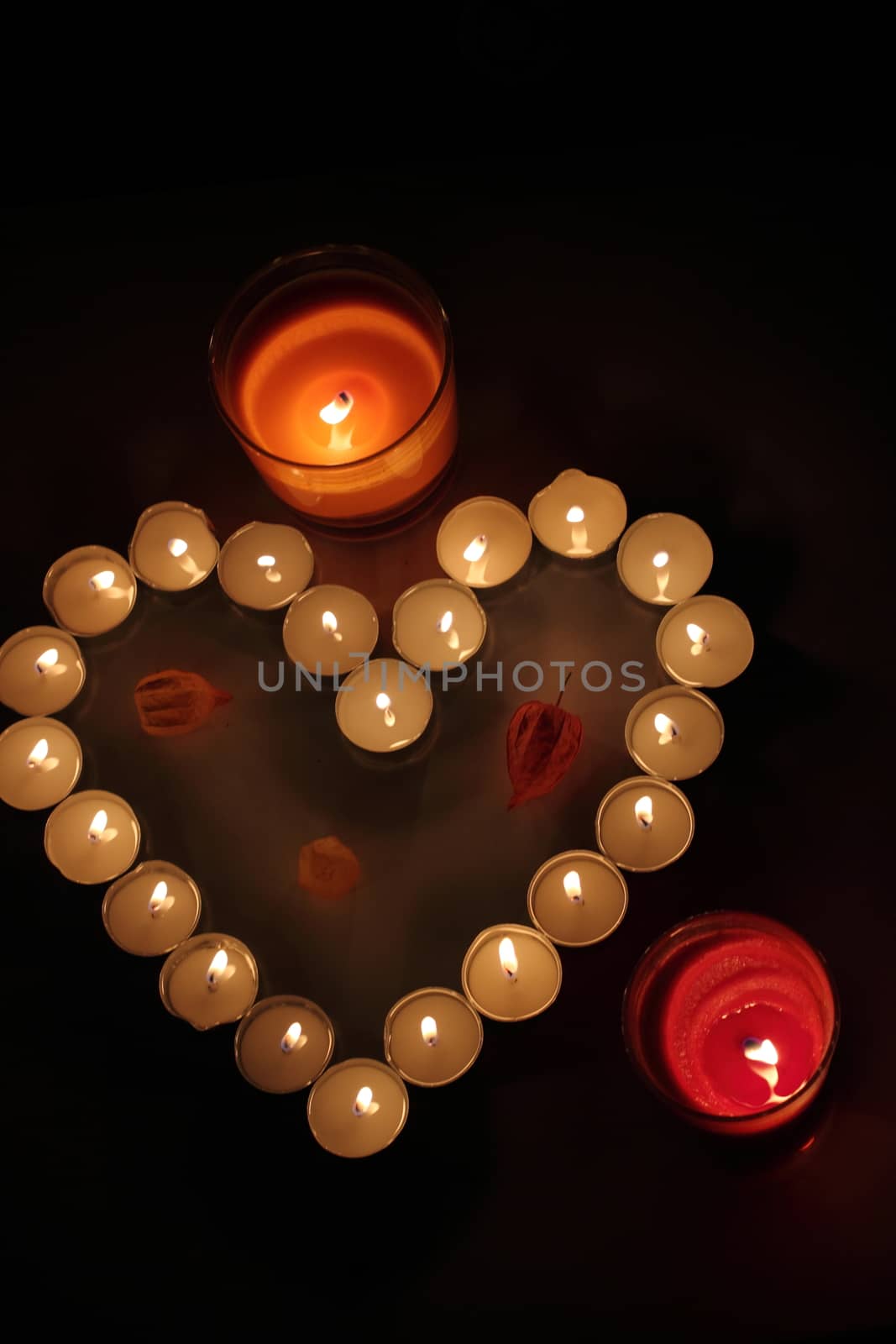 Heart of candles, a sign of love. romantic evening