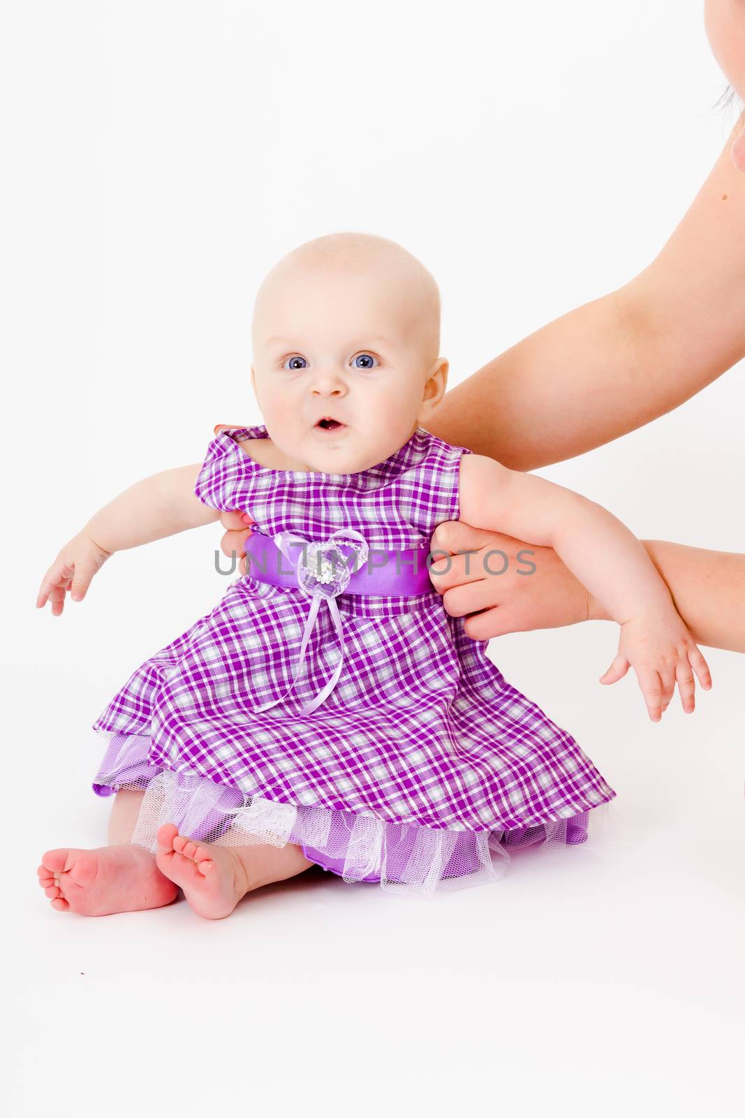 baby girl in a dress. studio photo