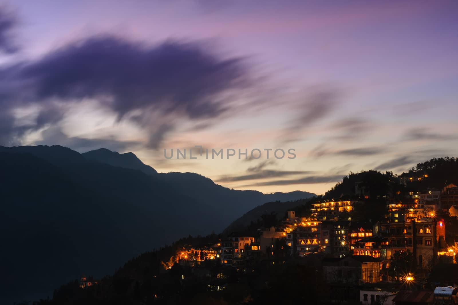 Beautiful sunset in Sapa city at twilight, can see peak fansipan mountain in north Vietnam.