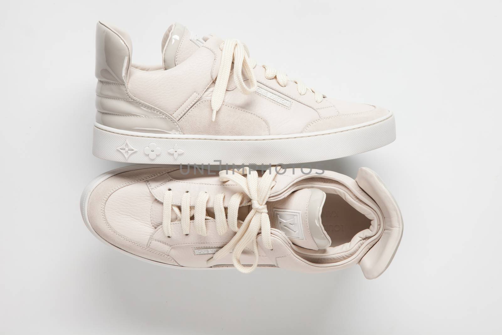 Ukraine, Kiev - FEBRUARY 2, 2015: Louis Vuitton sneaker closeup on white background.