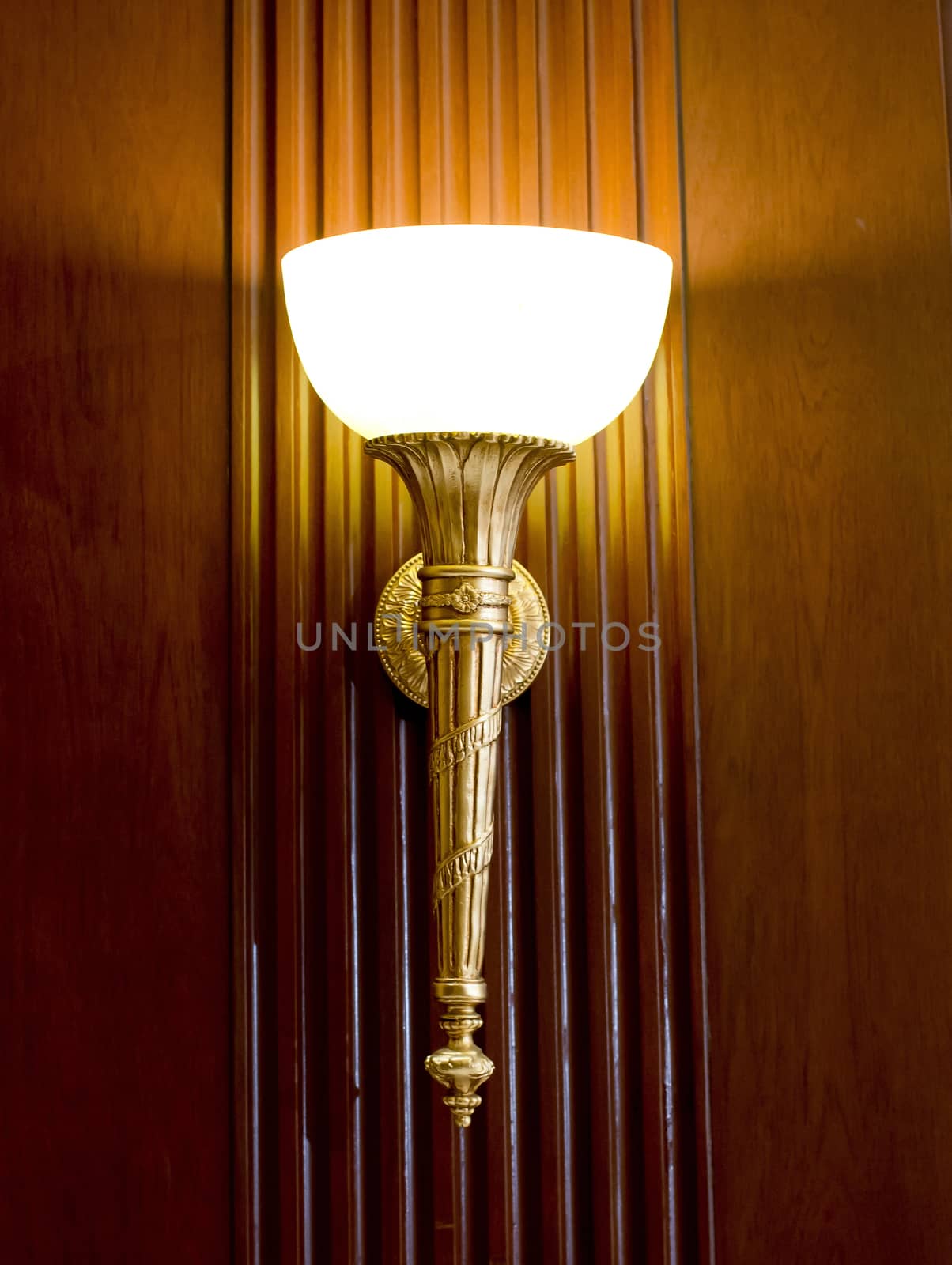 Lighted classic sconce on the wall