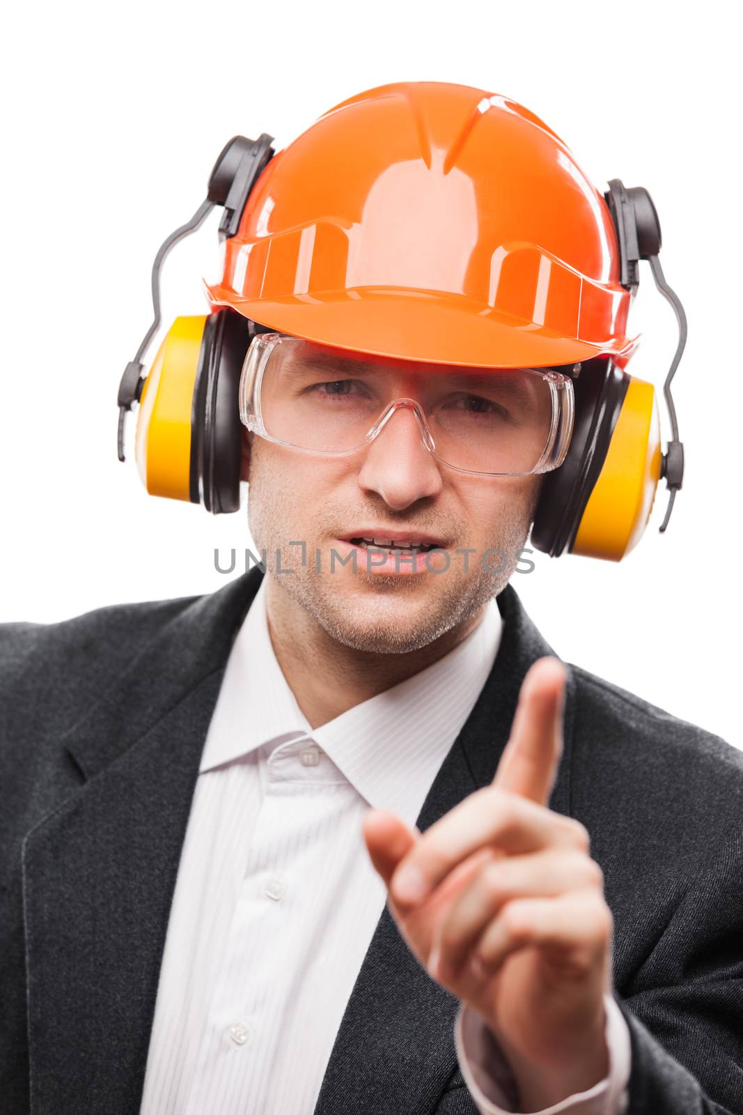 Businessman in safety hardhat helmet gesturing exclamation point by ia_64