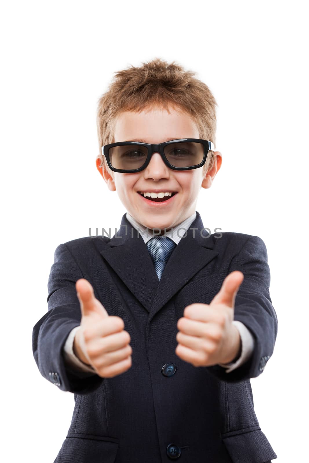 Smiling child boy in business suit wearing sunglasses gesturing  by ia_64
