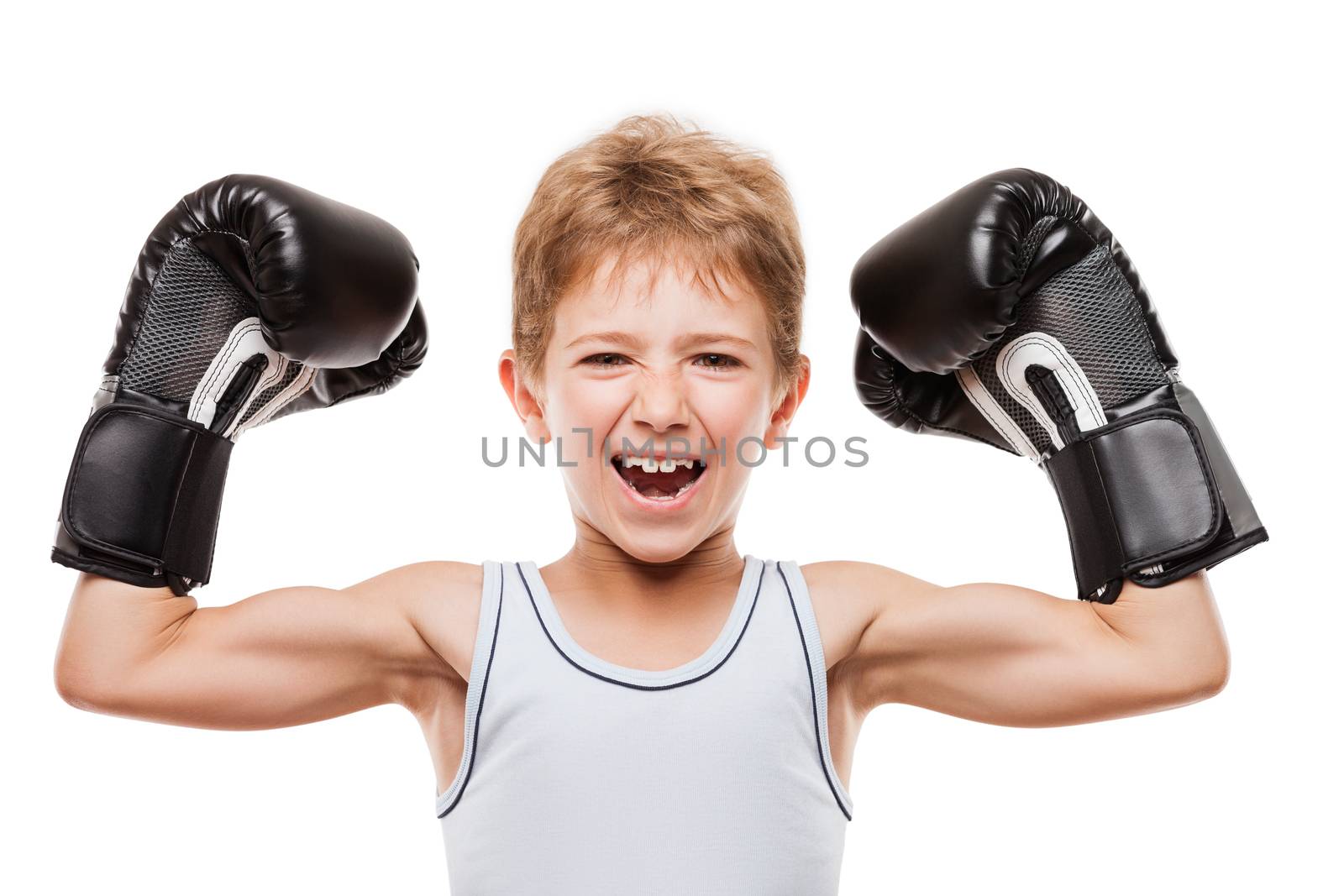 Martial art sport success and win concept - smiling boxing champion child boy gesturing for first place victory triumph