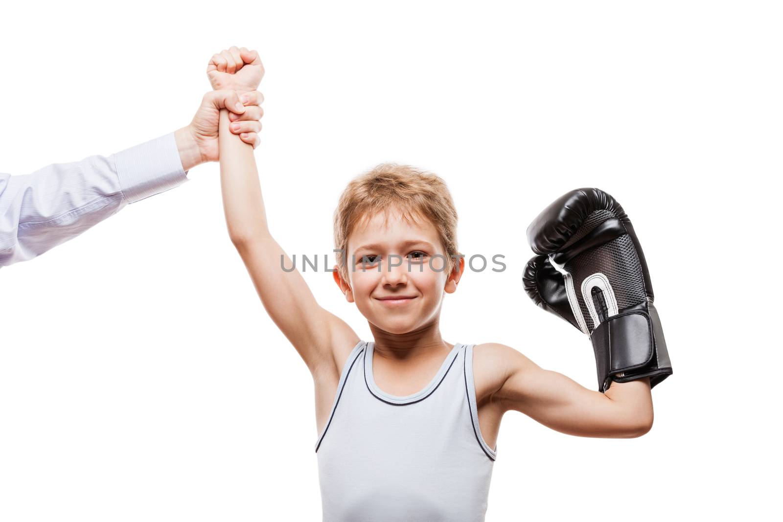 Martial art sport success and win concept - smiling boxing champion child boy gesturing for first place victory triumph