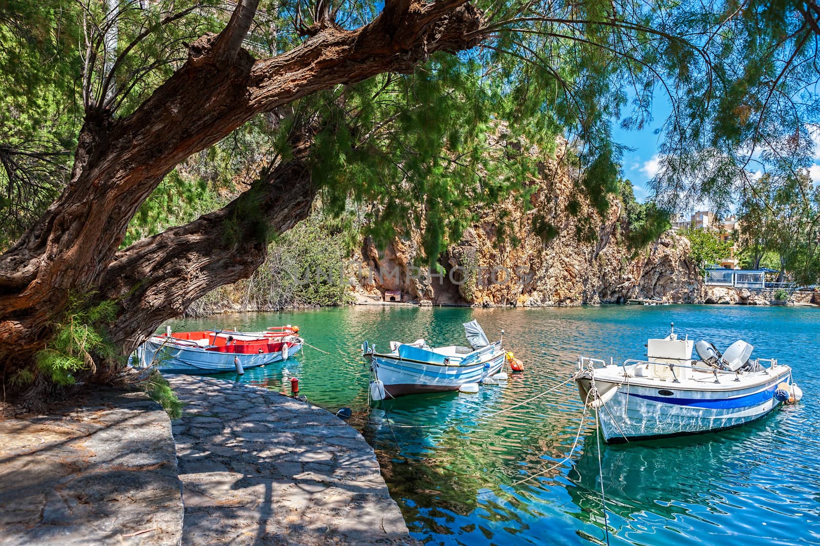 Boats on Lake Voulismeni. Agios Nikolaos, Crete, Greece by vladimir_sklyarov