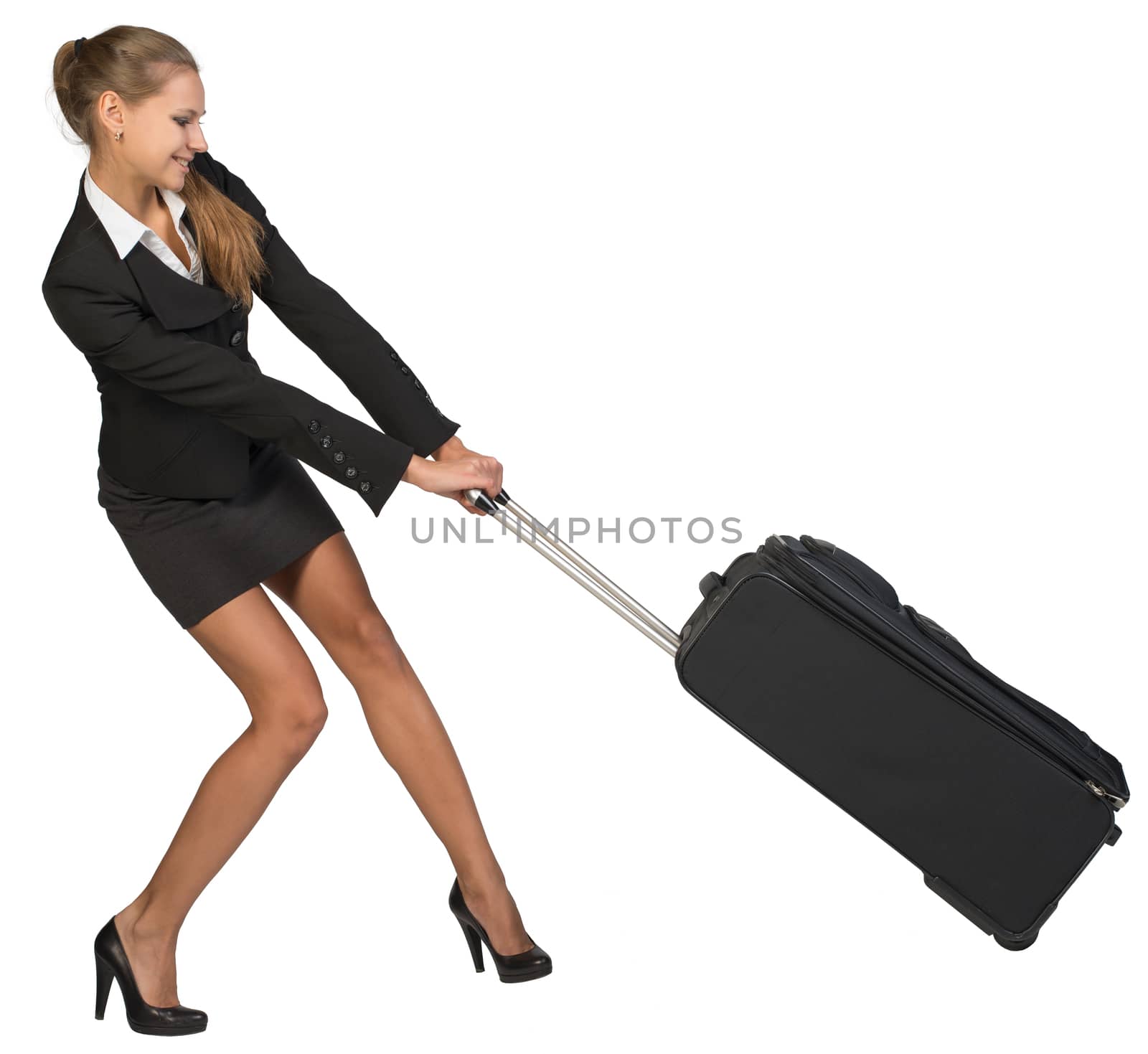 Businesswoman dragging heavy wheeled suitcase at utmost strain. Isolated over white background