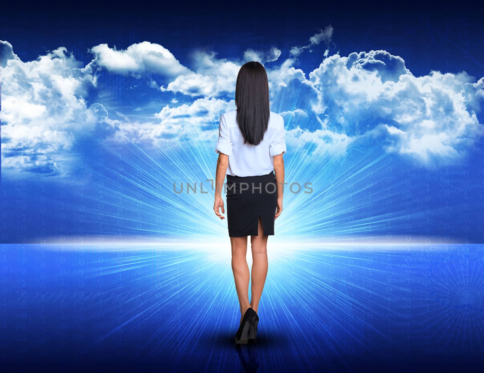 Businesswoman walking against digitally generated spacy blue landscape with rising sun and cloudy sky