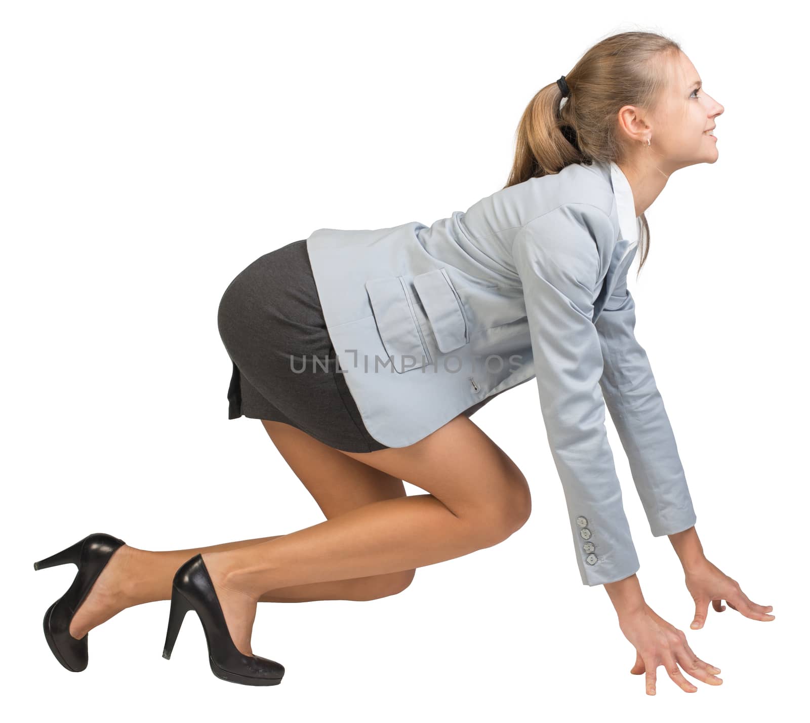 Businesswoman standing in running start pose, smiling, side view. Isolated over white background
