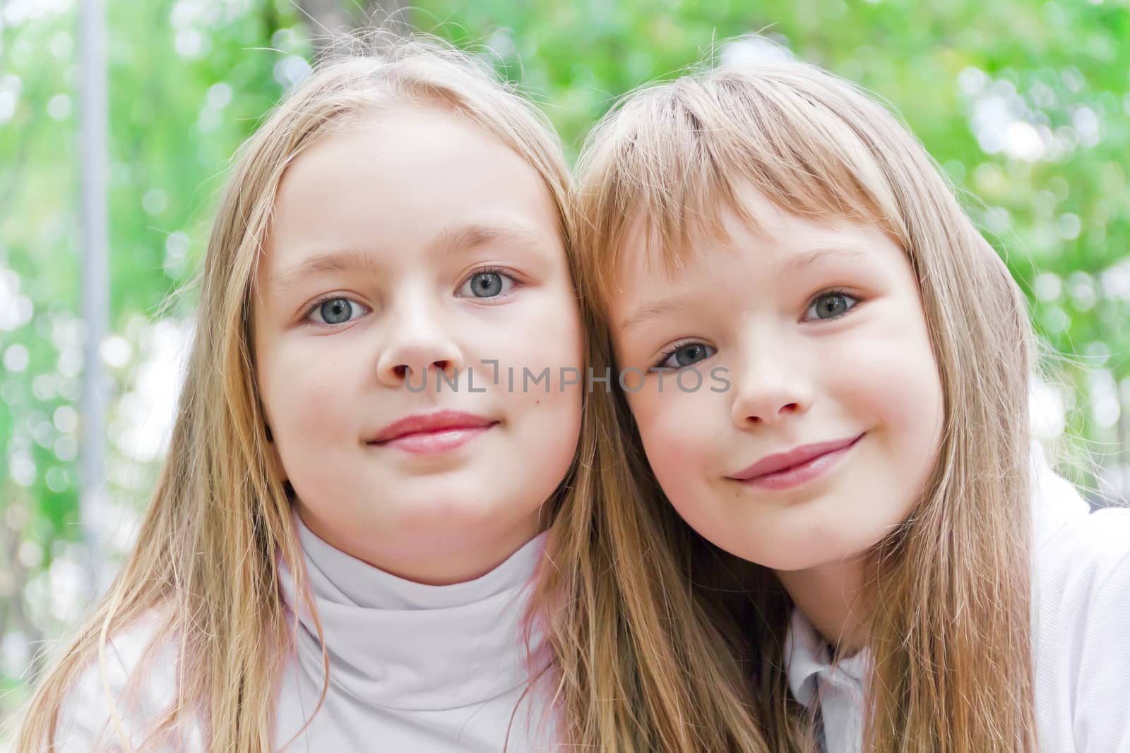 Photo of two cute girls with long hairs