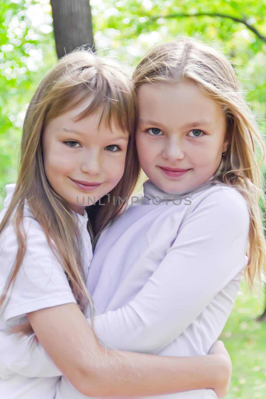 Photo of two cute girls with long hairs