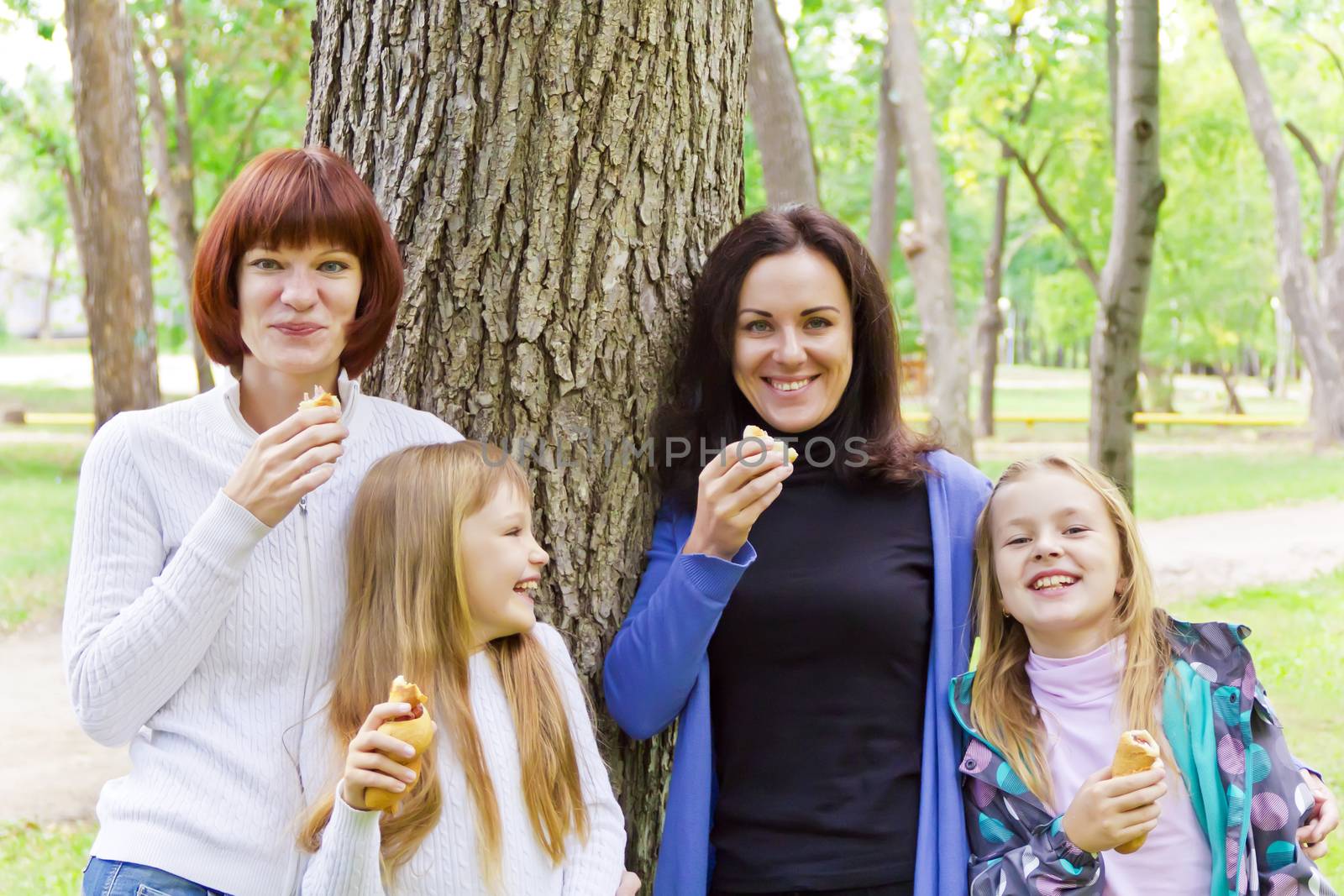 Photo of group laugh people are eating in summer