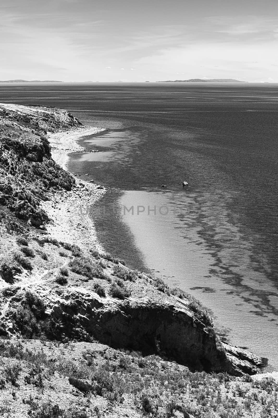 Monochrome image of the shoreline on the northern tip of the popular travel destination Isla del Sol (Island of the Sun) in Lake Titicaca close to Copacabana in Bolivia
