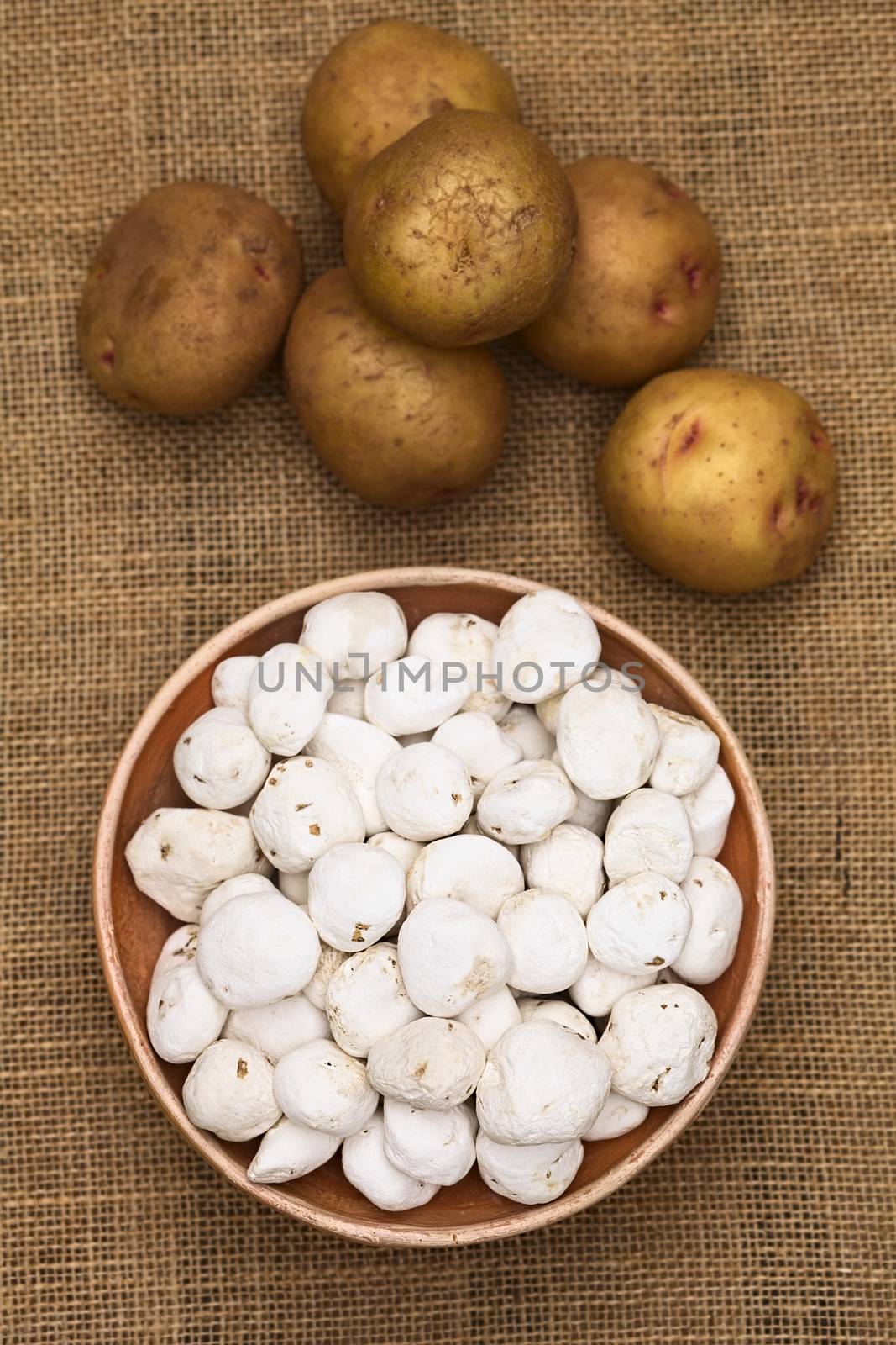 Tunta, also called white chuno or moraya, is a freeze-dried (dehydrated) potato made in the Andes region, mainly Bolivia and Peru. The potato is durable for a long time this way. Tunta and chuno are used in many traditional dishes in Bolivia (Selective Focus, Focus on the upper potatoes in the middle and the front of the bowl) (Photographed with natural light)