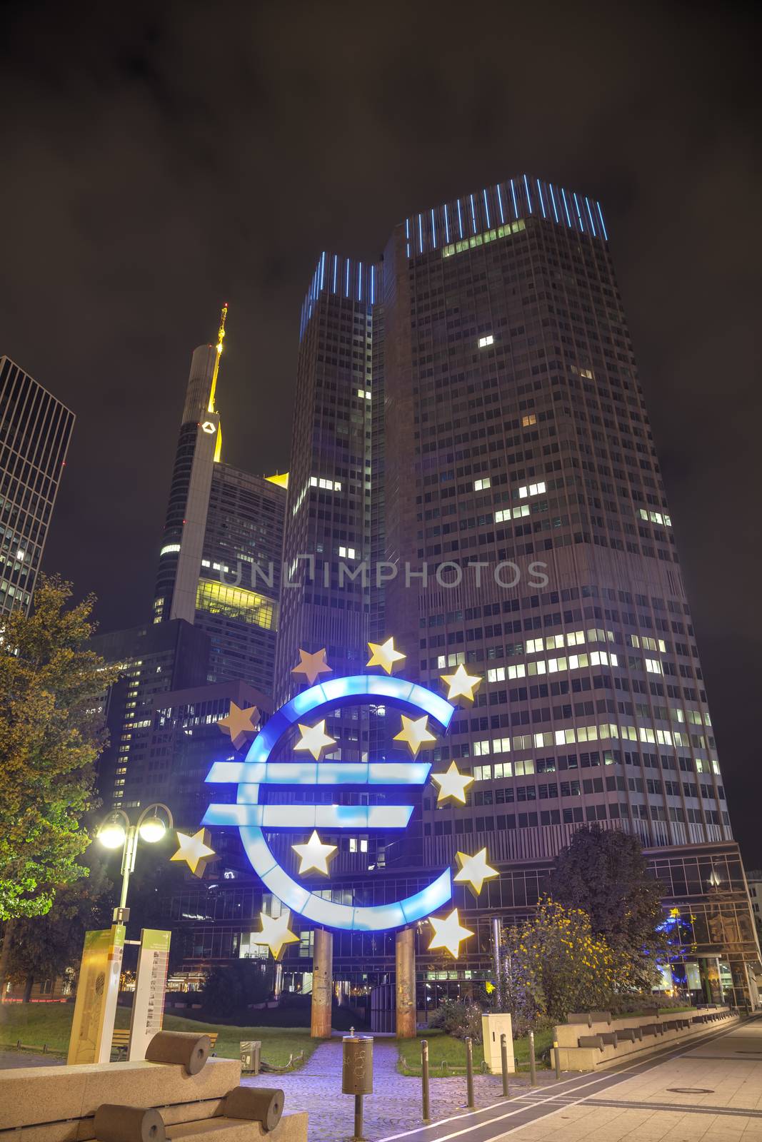 Euro sign in front of the European Central Bank building by AndreyKr