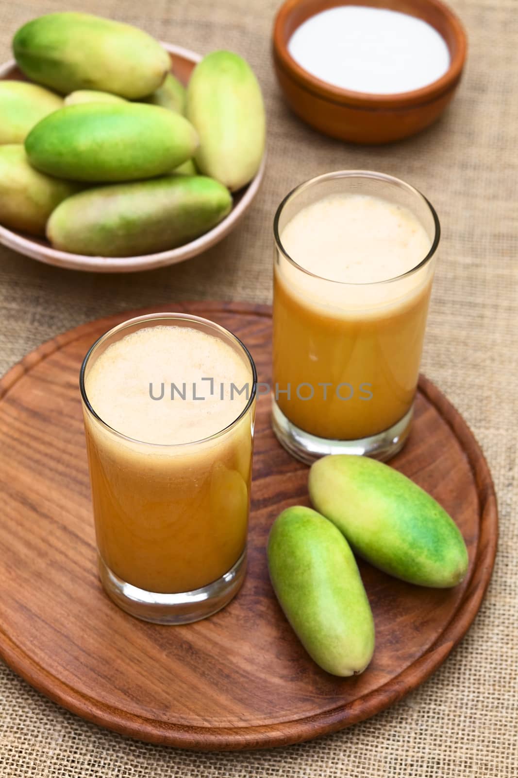 Fresh Juice Made of Banana Passionfruit (lat. Passiflora Tripartita) by ildi