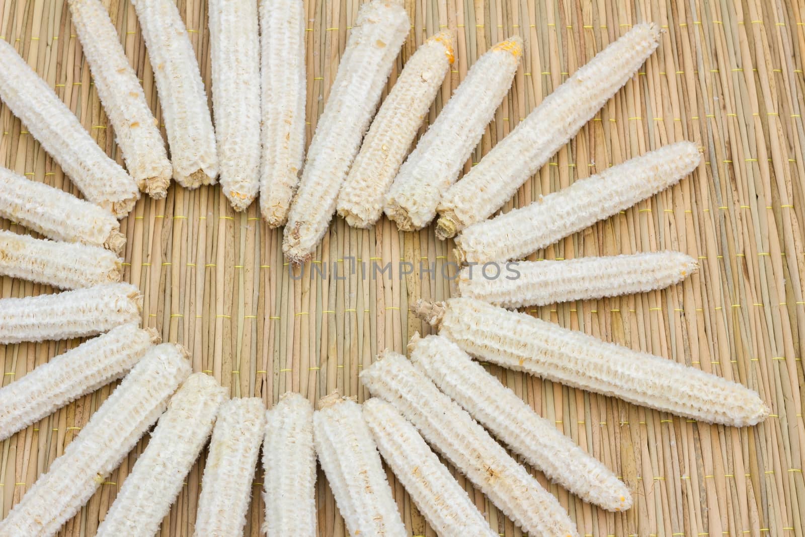 heart shape made of corn cobs on thai traditional mat, love concept