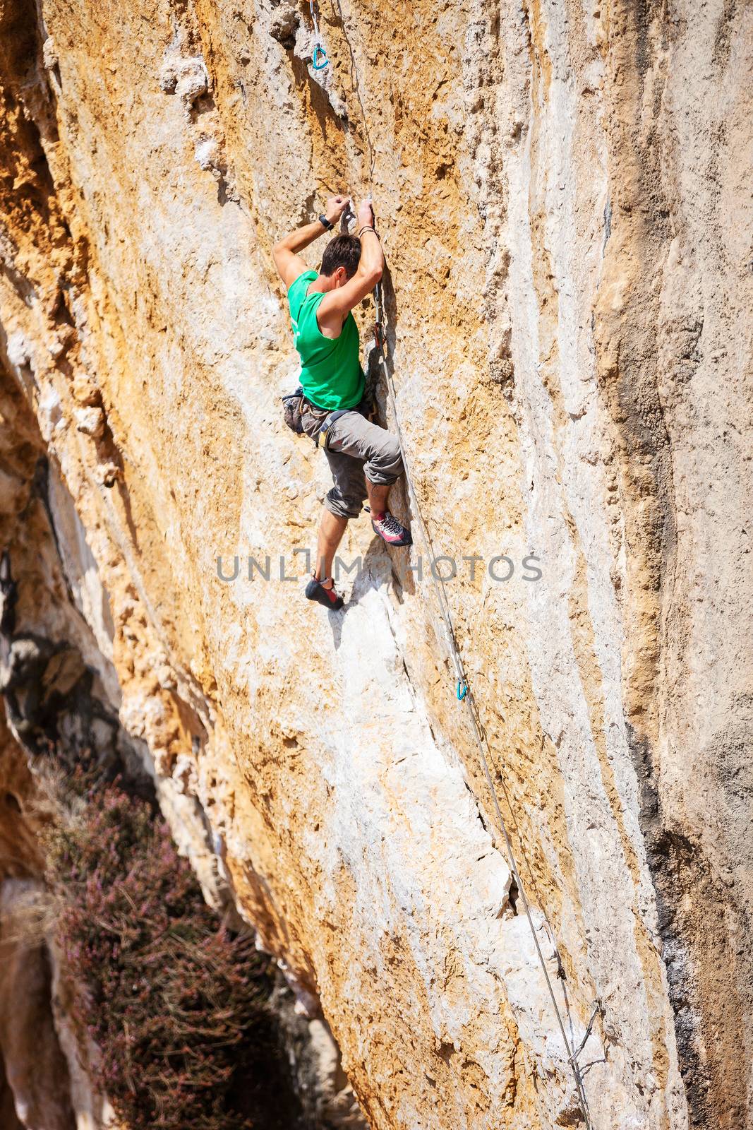 Rock climber on a face of a cliff