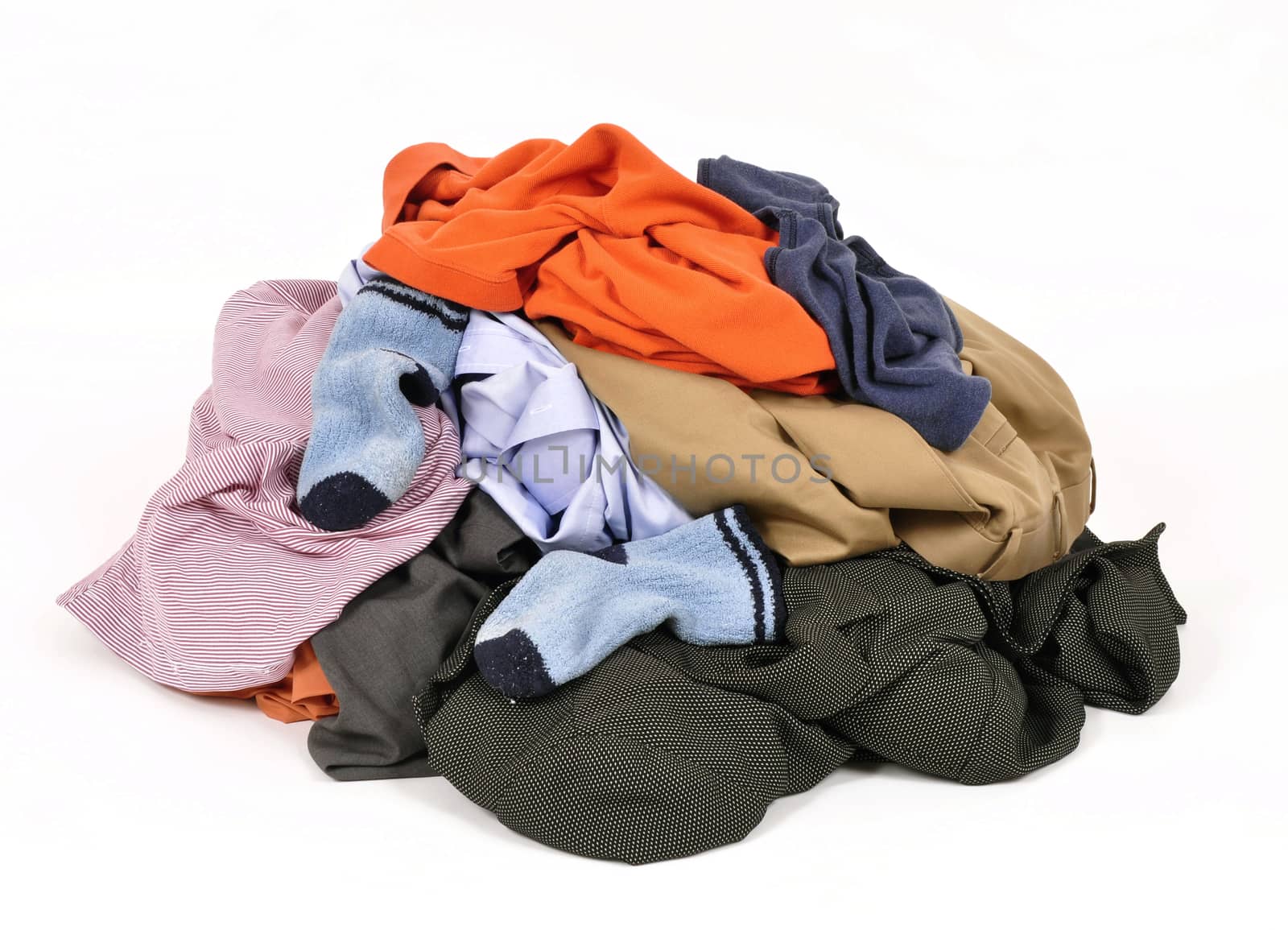 Big heap of colorful dirty clothes isolated on white background