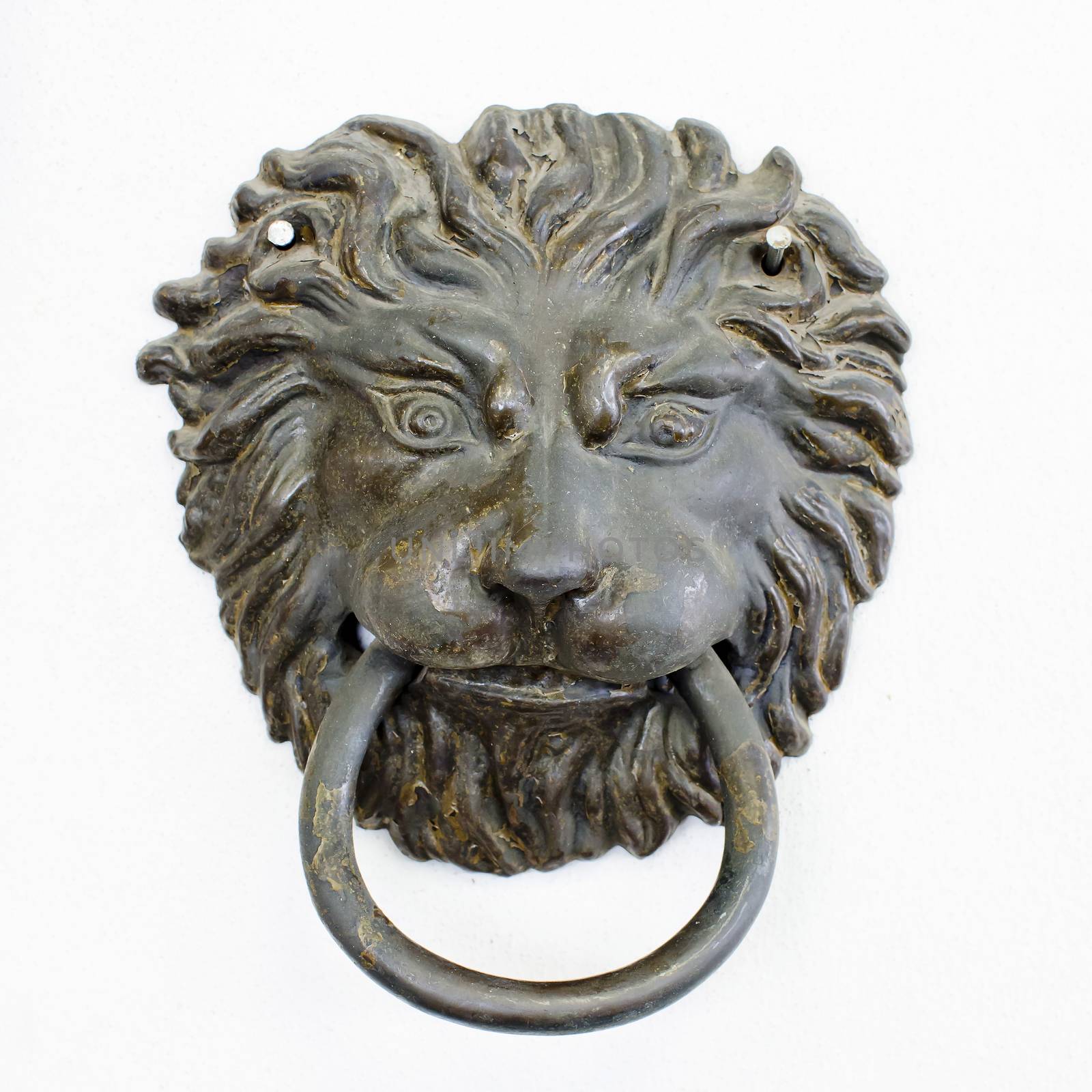 old style lion's head knocker with rust