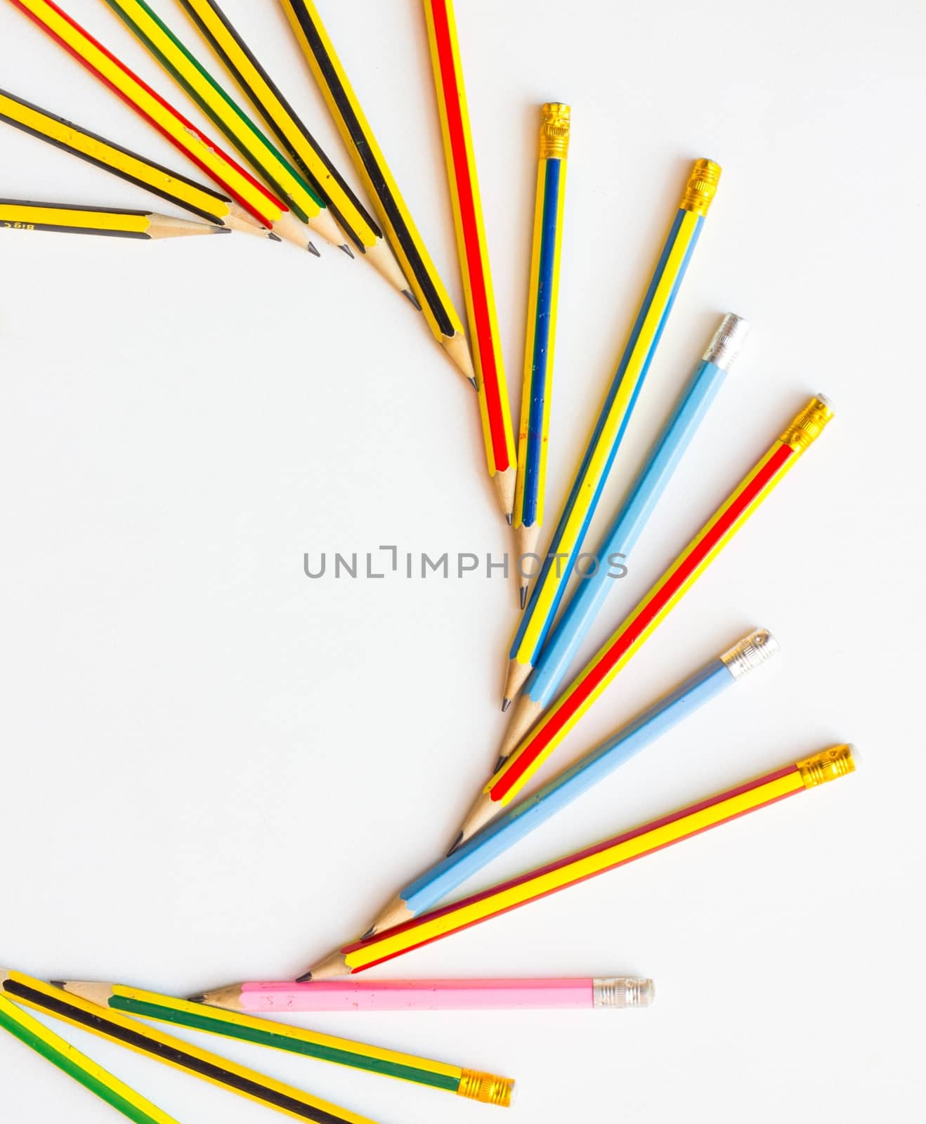 colorful pencils on the white paper, view from above by a3701027